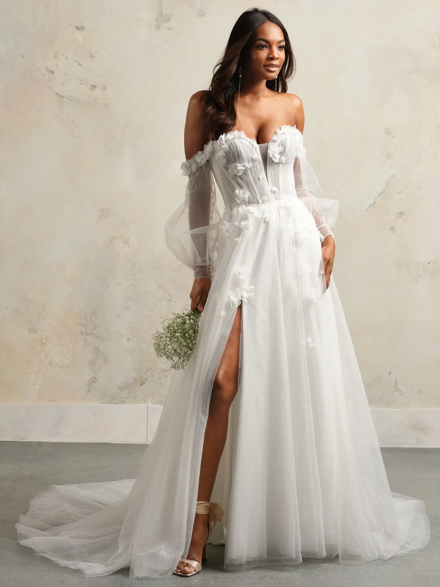 Maggie Sottero Allison tulle A-line gown front view with floral details and slit.