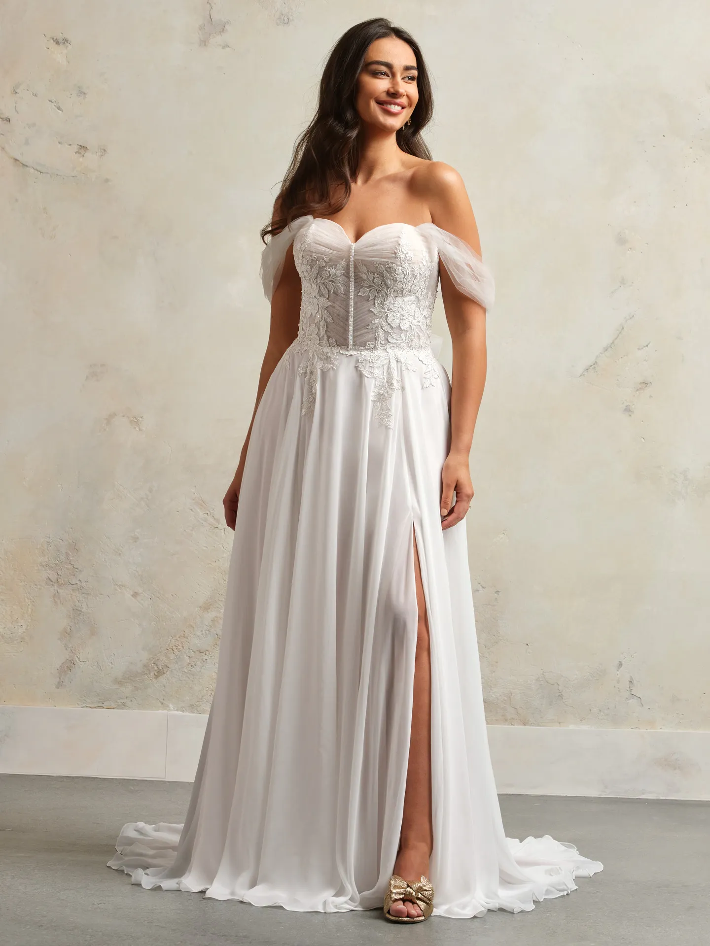 Rebecca Ingram Blake front view, flowy tulle wedding dress with slit and lace corset.