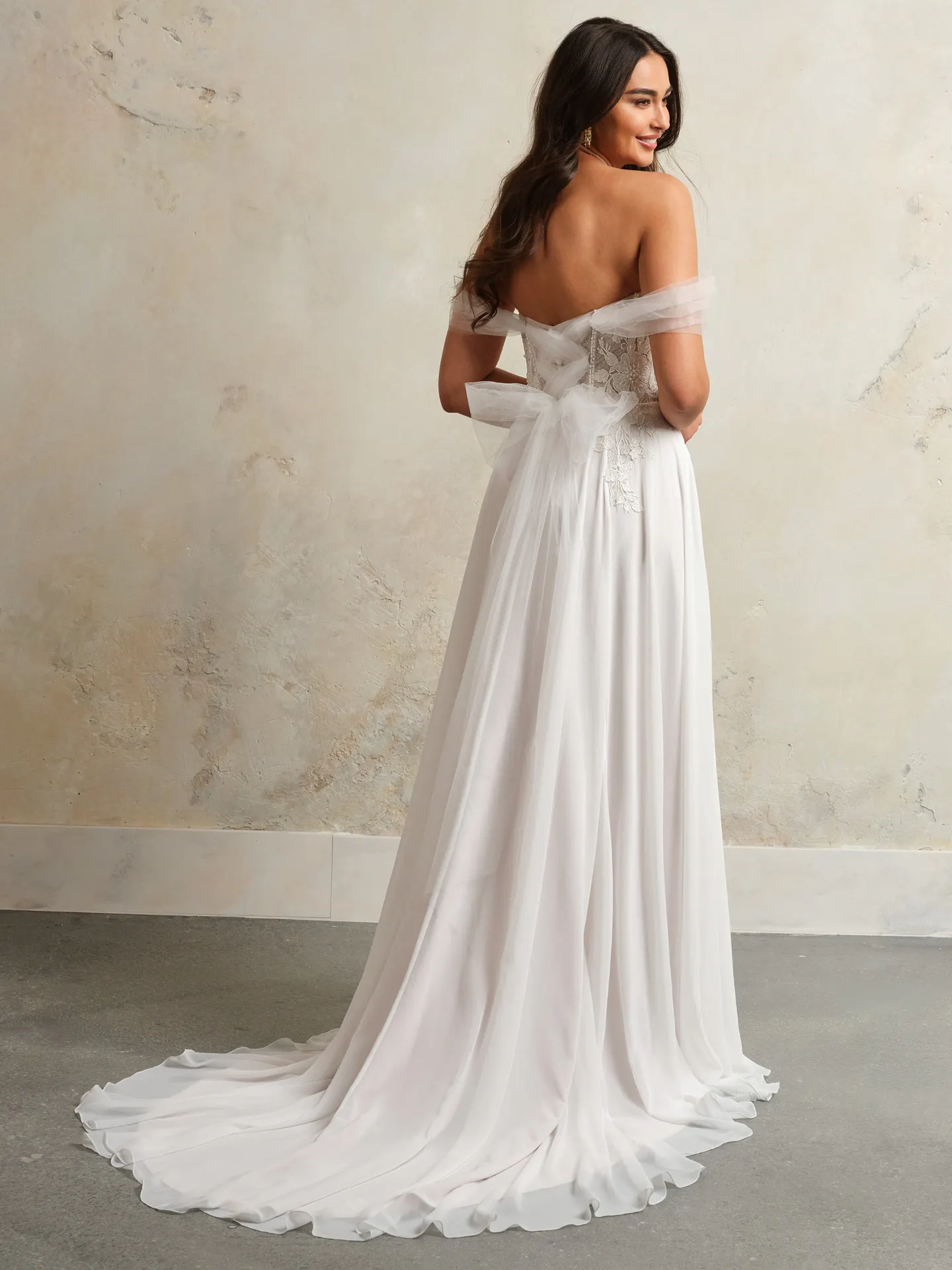Blake wedding dress back view, flowy tulle corset with pearls.