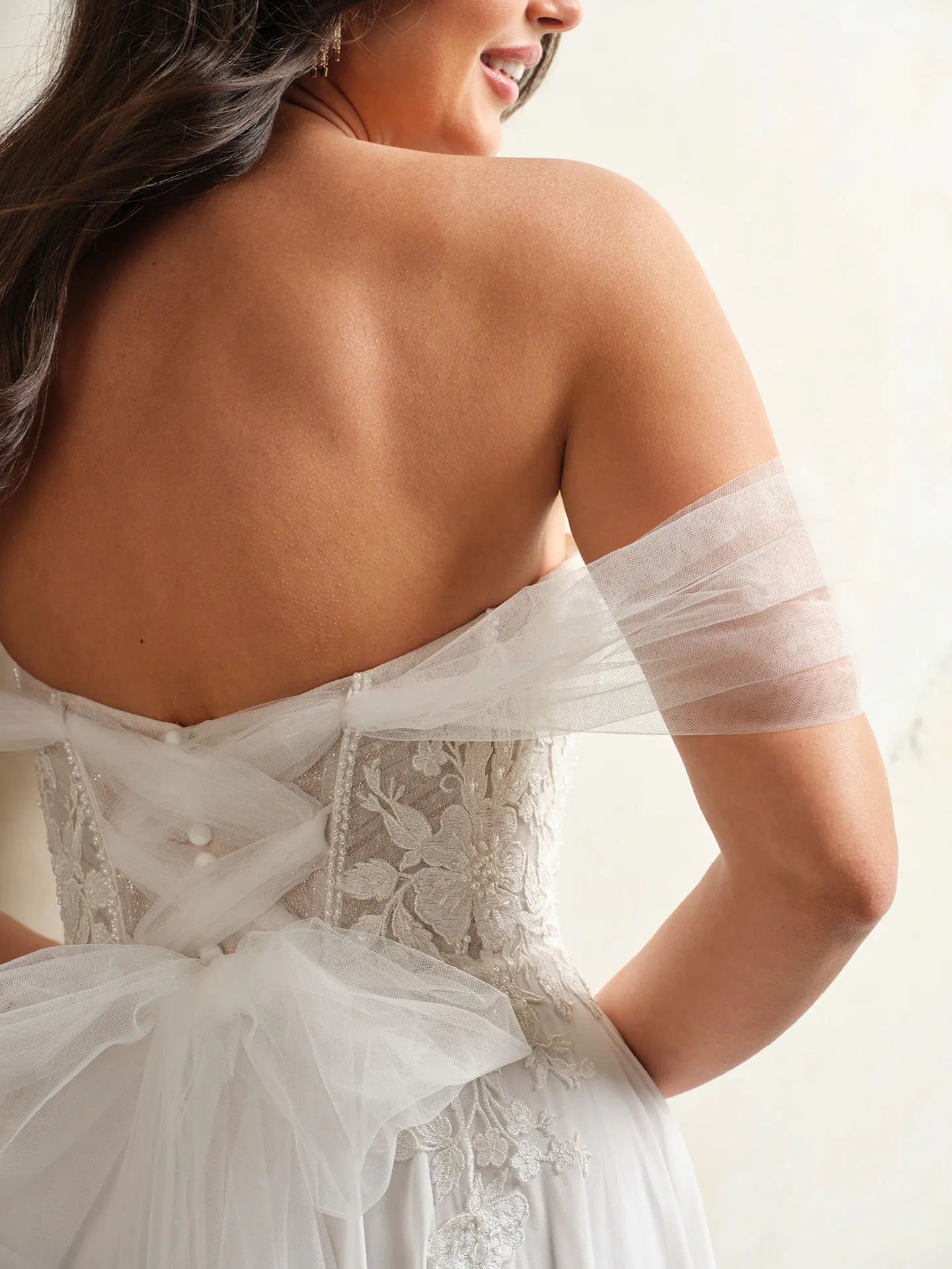 Rebecca Ingram Blake back view lace corset with floral embroidery and tulle bow detail.