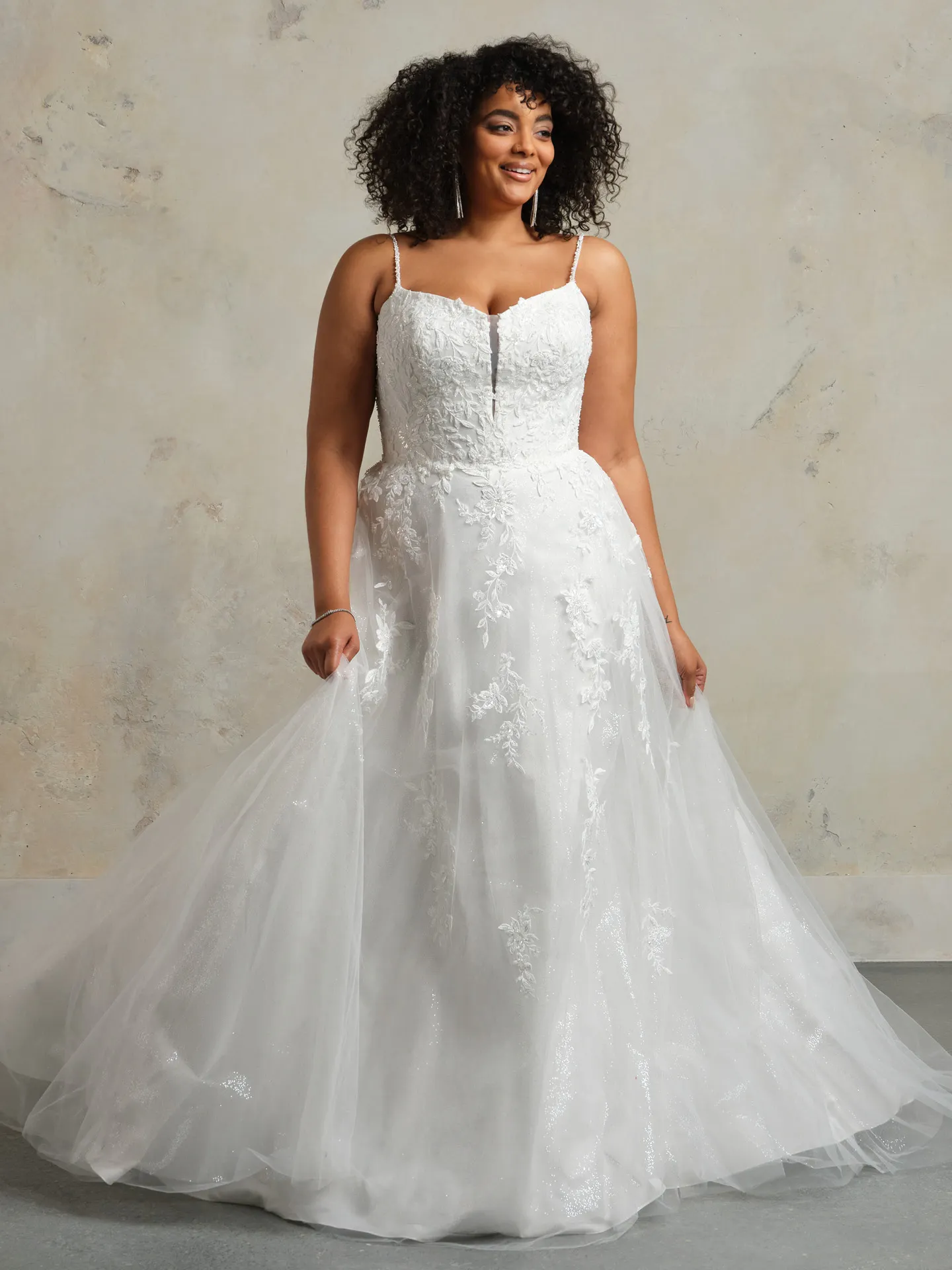 Catherine bridal dress front view with spaghetti straps and floral lace detail.