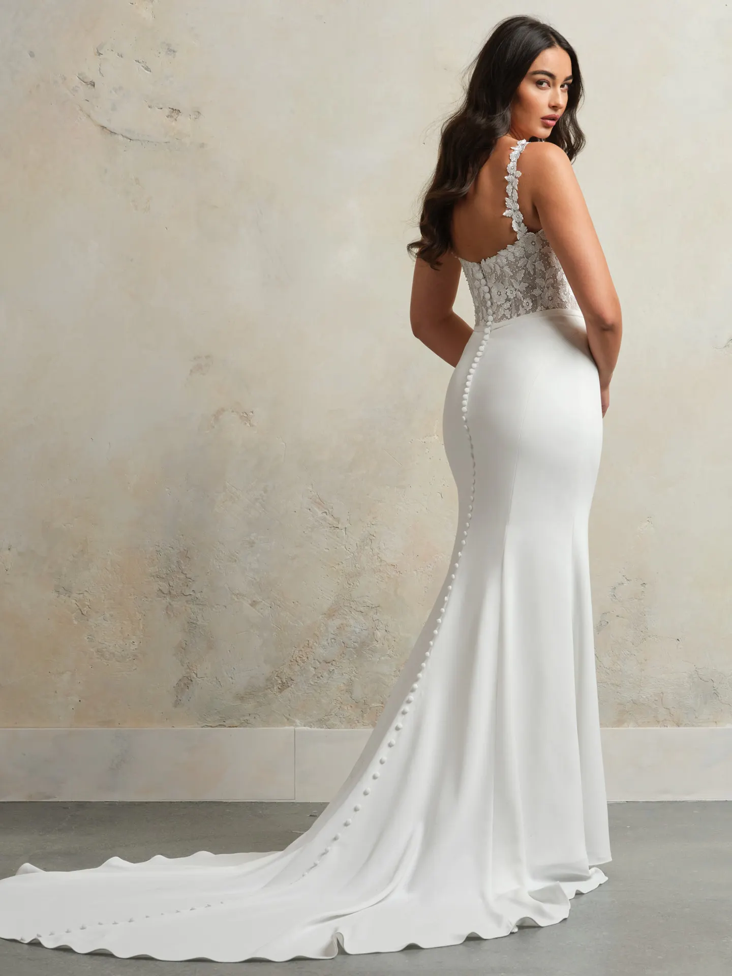 Rebecca Ingram bridal gown back view with lace bodice and train.