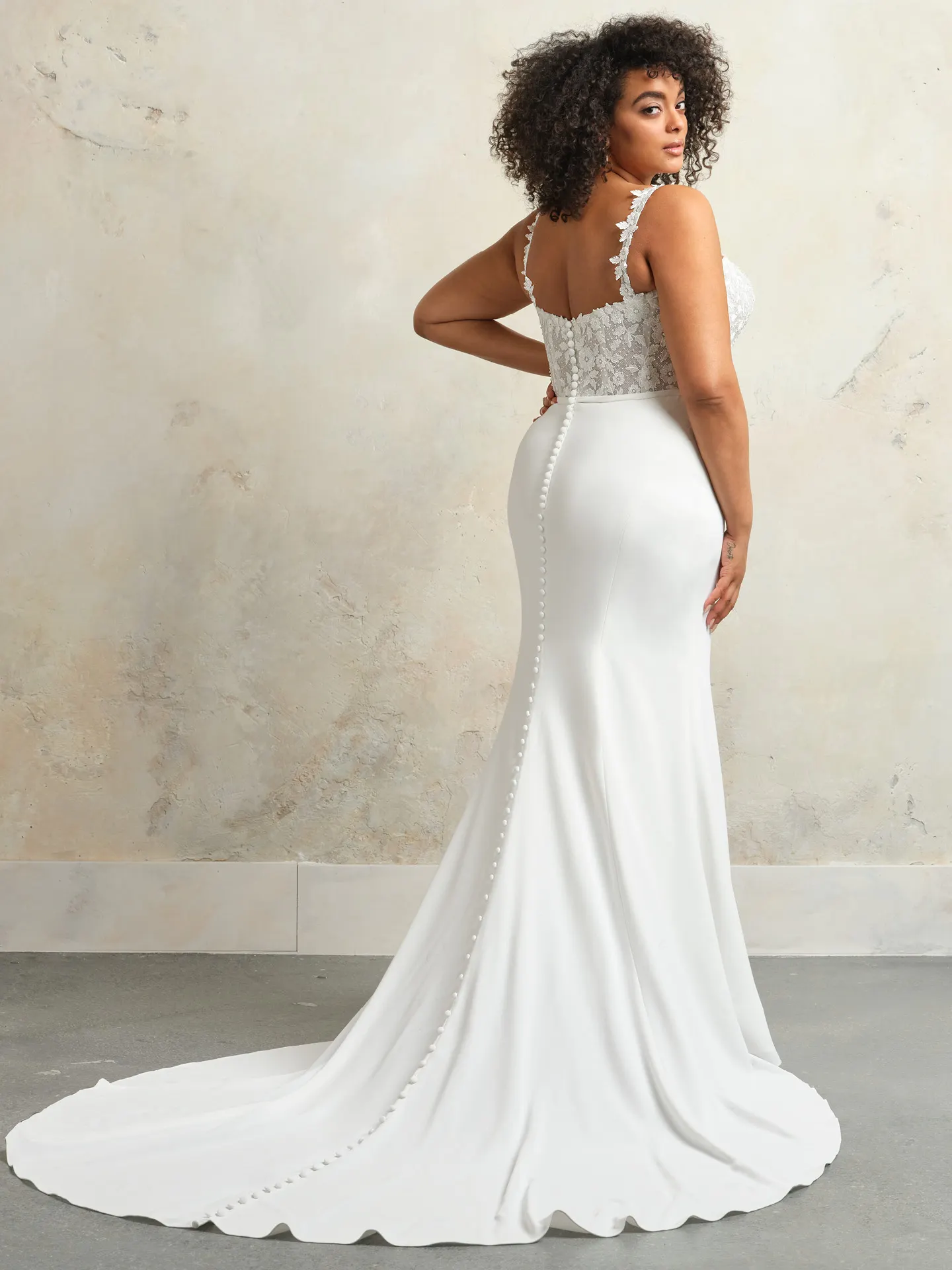 Rebecca Ingram Cecilia back view lace bodice gown with buttoned train.