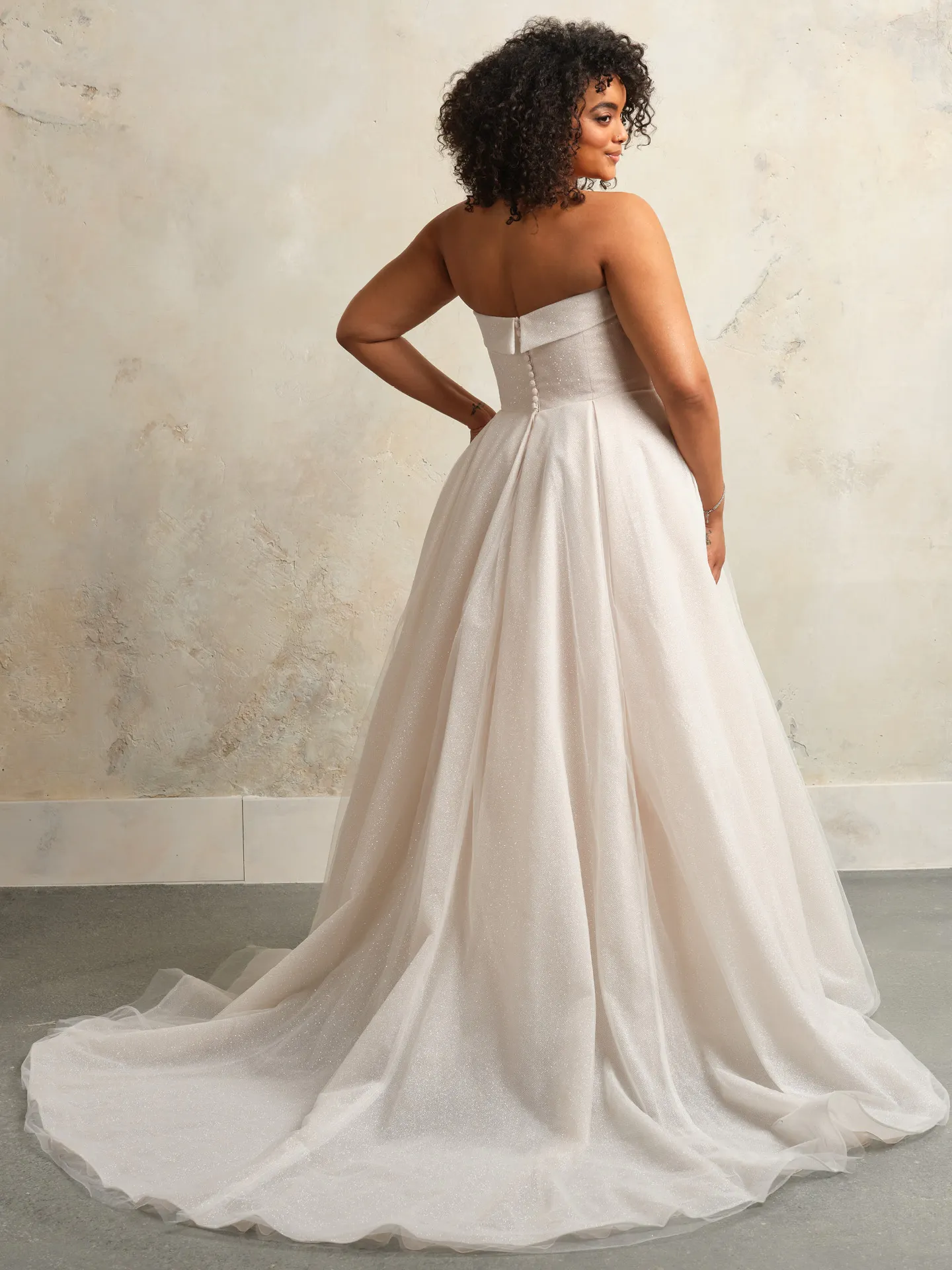 Rebecca Ingram Elizabeth back view A-Line bridal dress with banded cuffs.