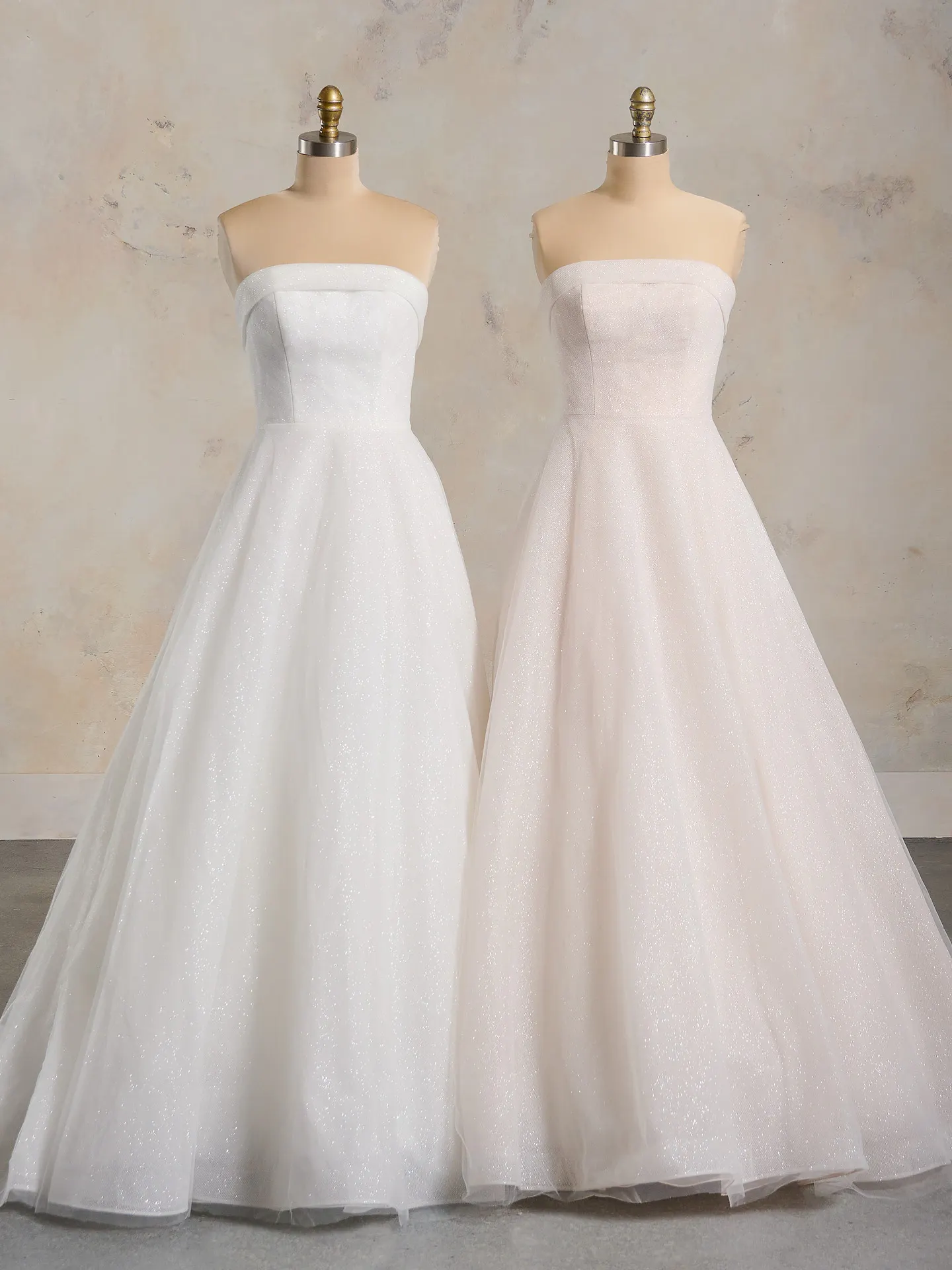 Elizabeth banded cuff bridal dress front view on mannequins.