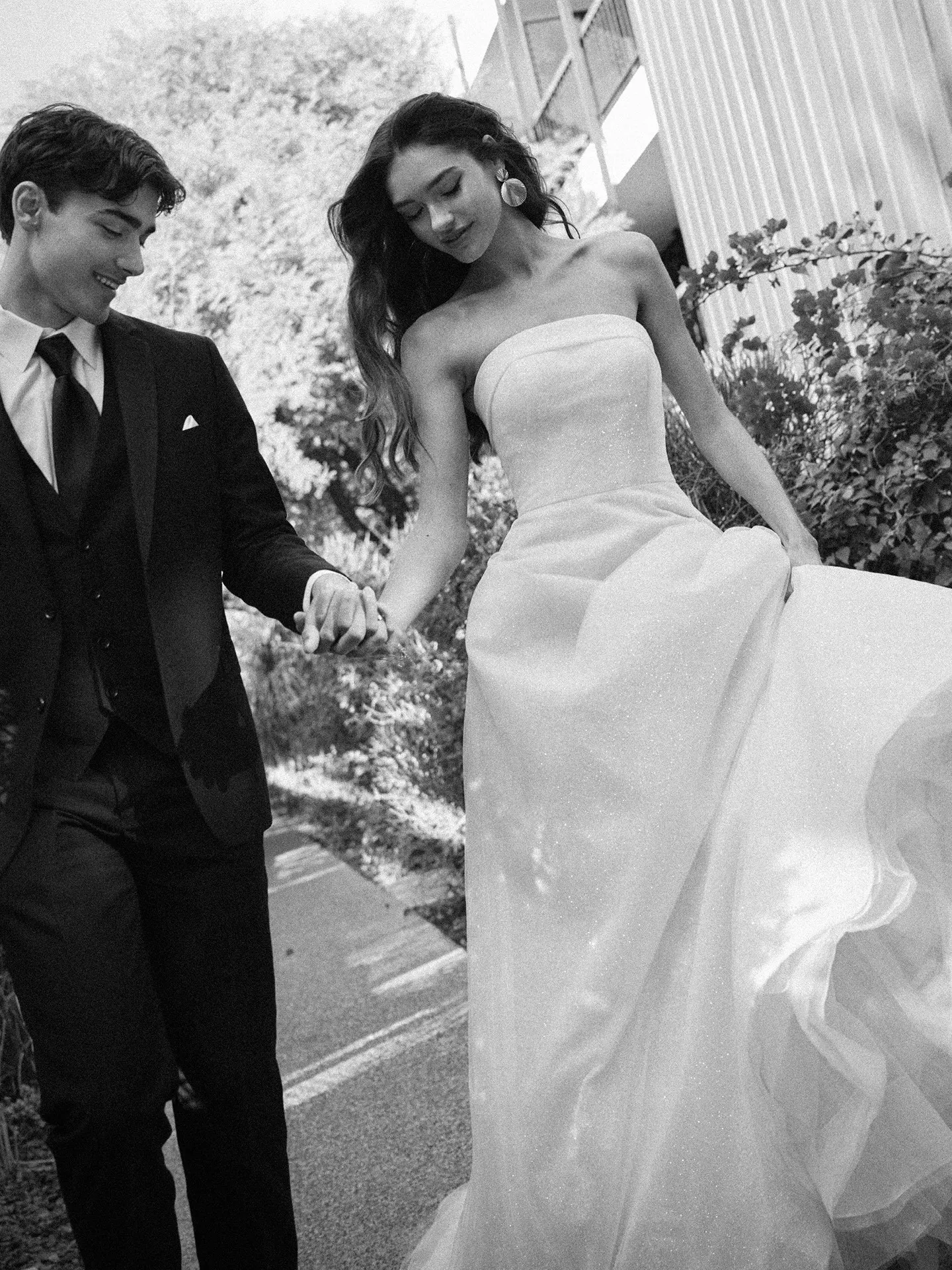 Maggie Sottero Elizabeth front view soft A-line dress with banded cuff in garden setting