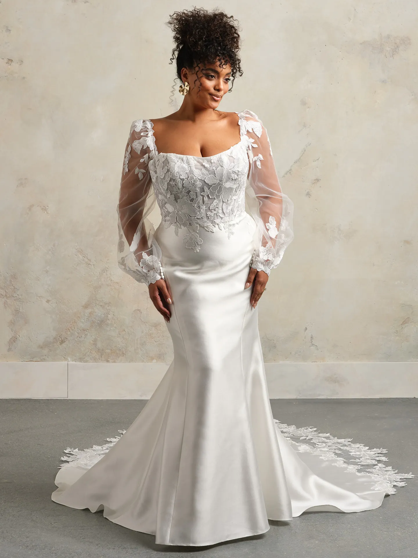 Romantic Goldie front view; lace dress with bishop sleeves and long train.