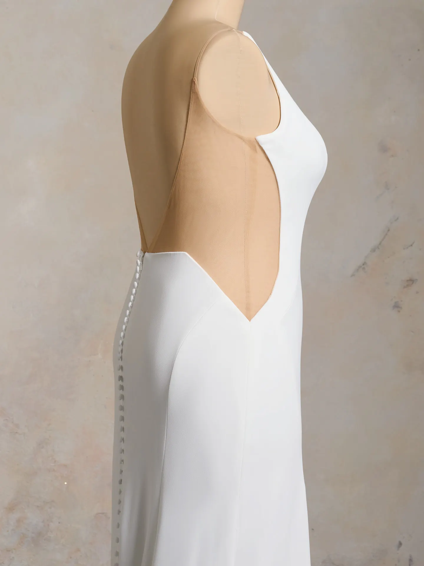Rebecca Ingram Hope side view wedding dress with scoop neckline and button detail.