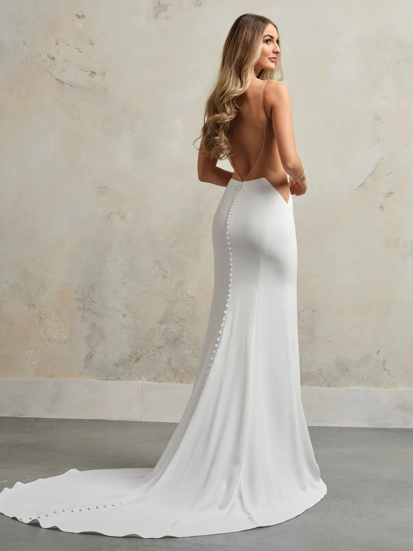 Sottero Hope back view, simple wedding dress with scoop neckline and button detail.