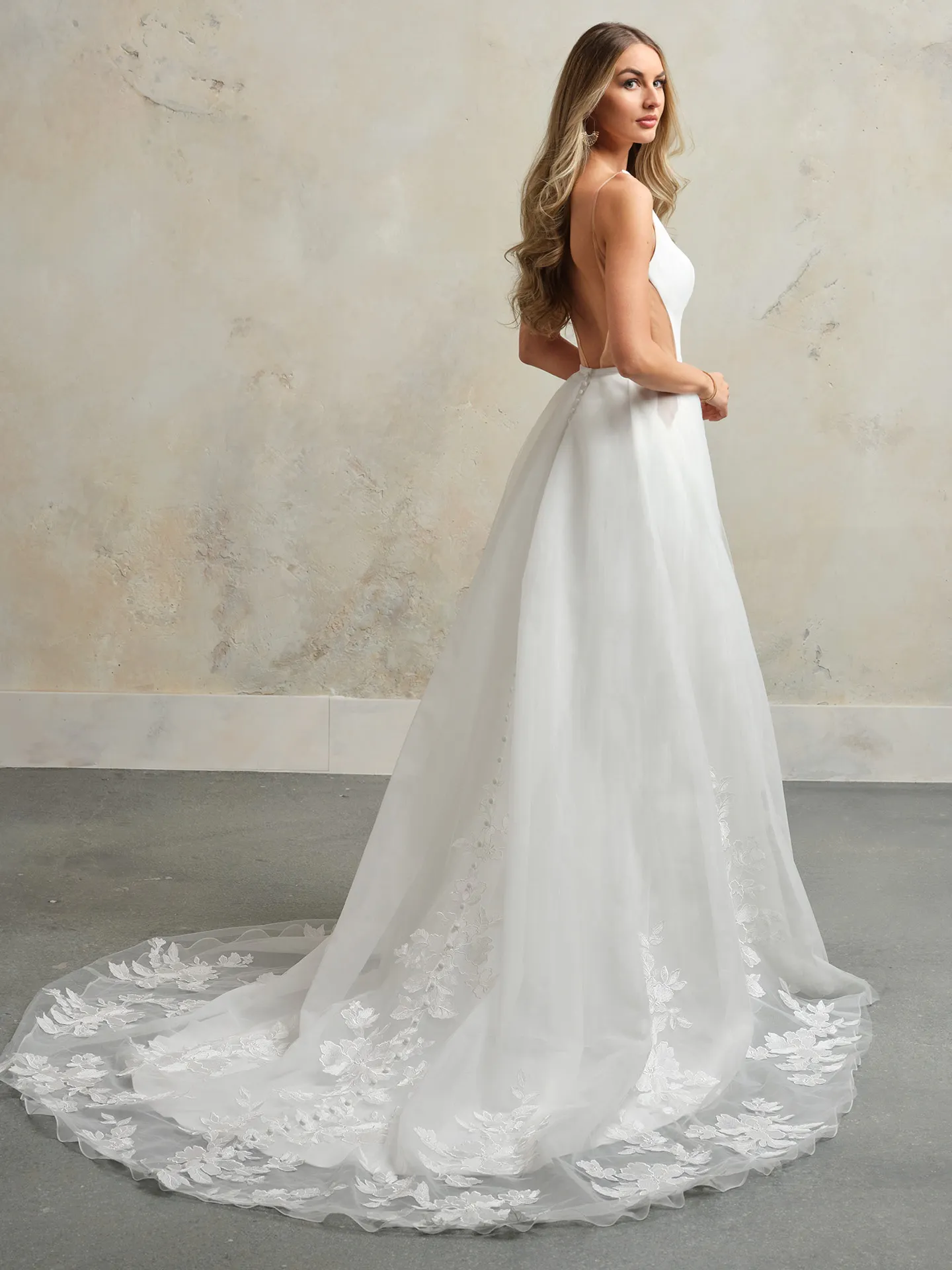Rebecca Ingram Hope side view, scoop neckline, trailing skirt with floral details