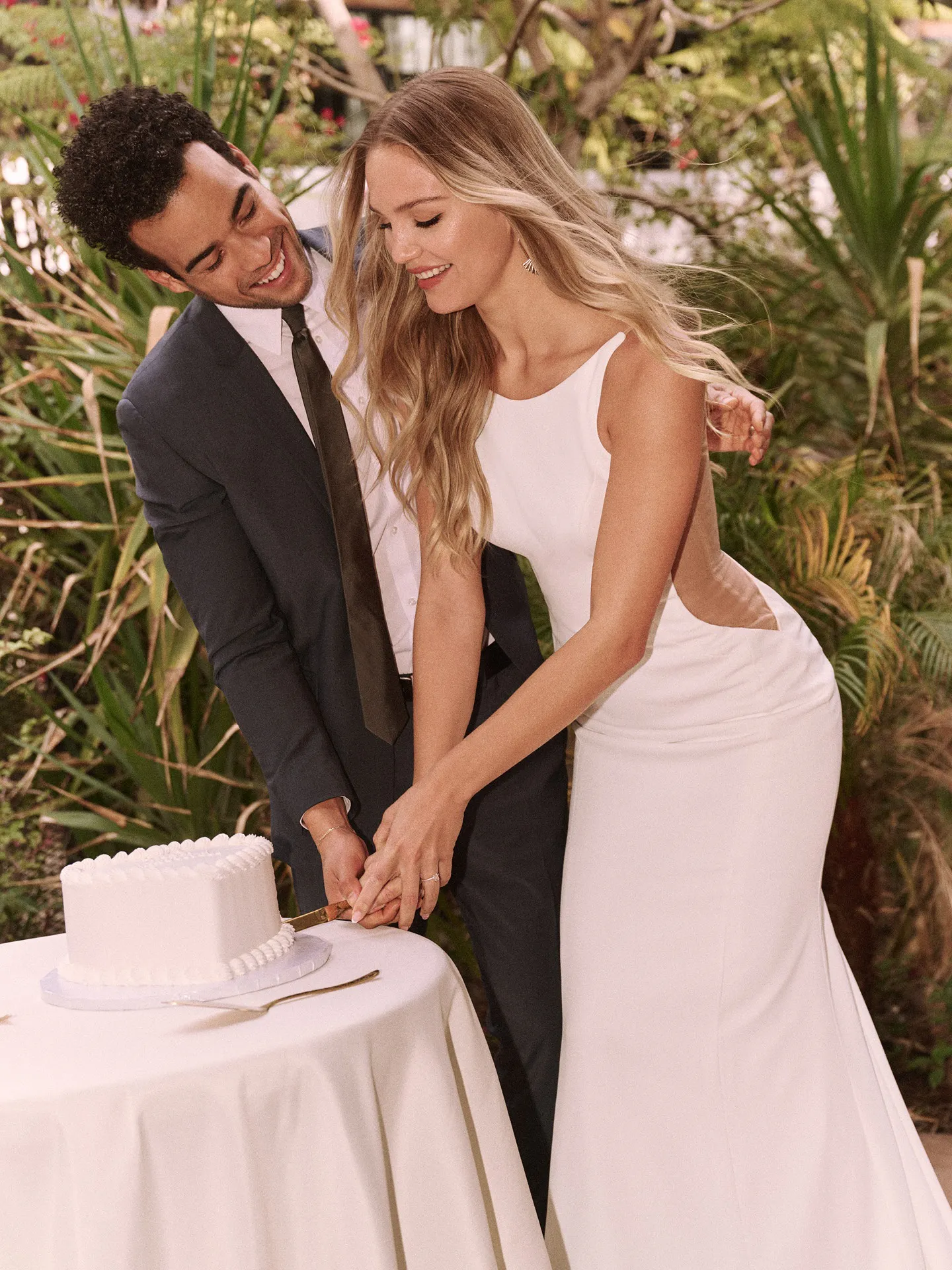 Rebecca Ingram sheath dress side view, cutting cake outdoors