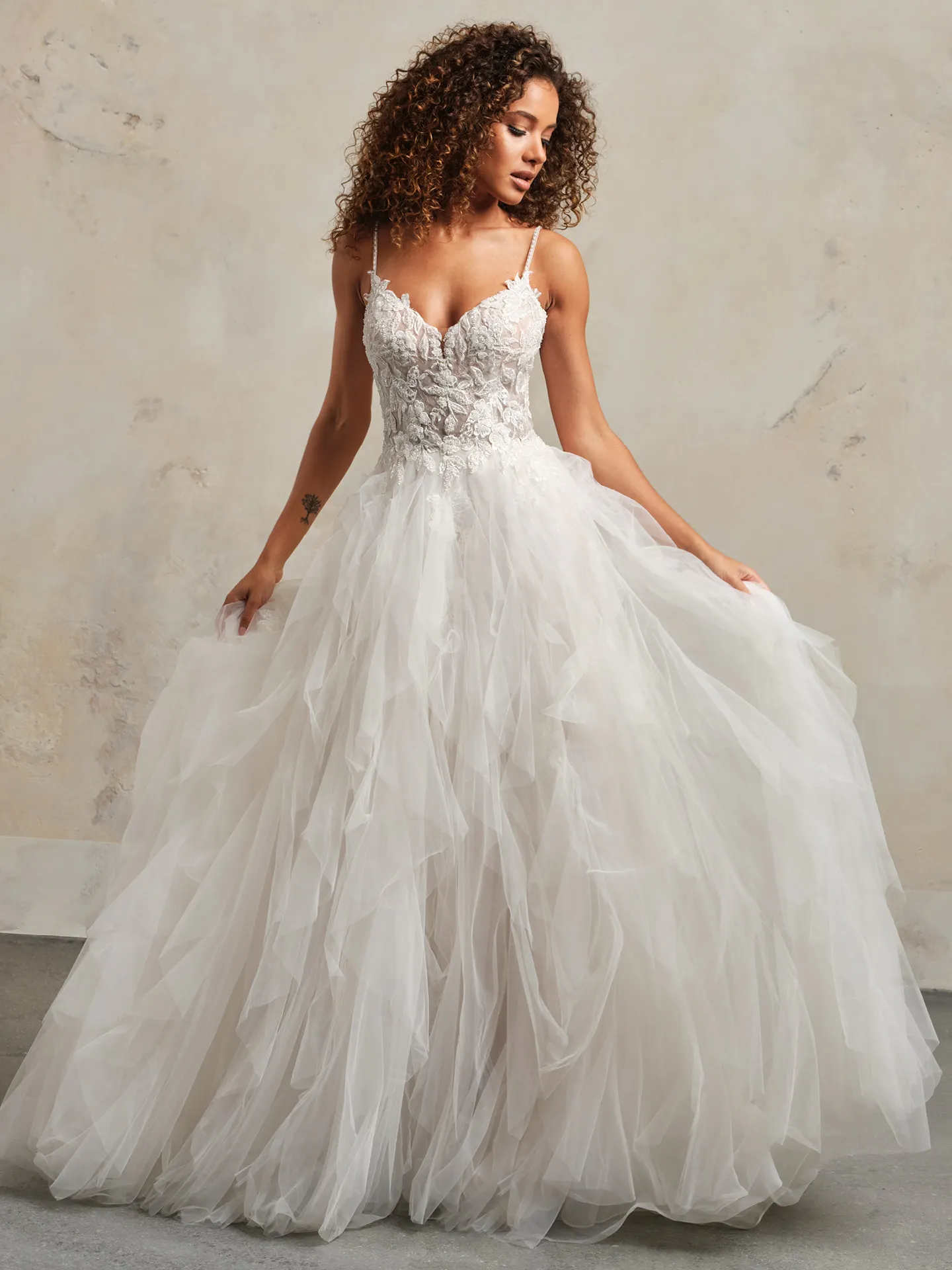 Whimsical Lucy wedding dress, front view, with crystal buttons and lace bodice