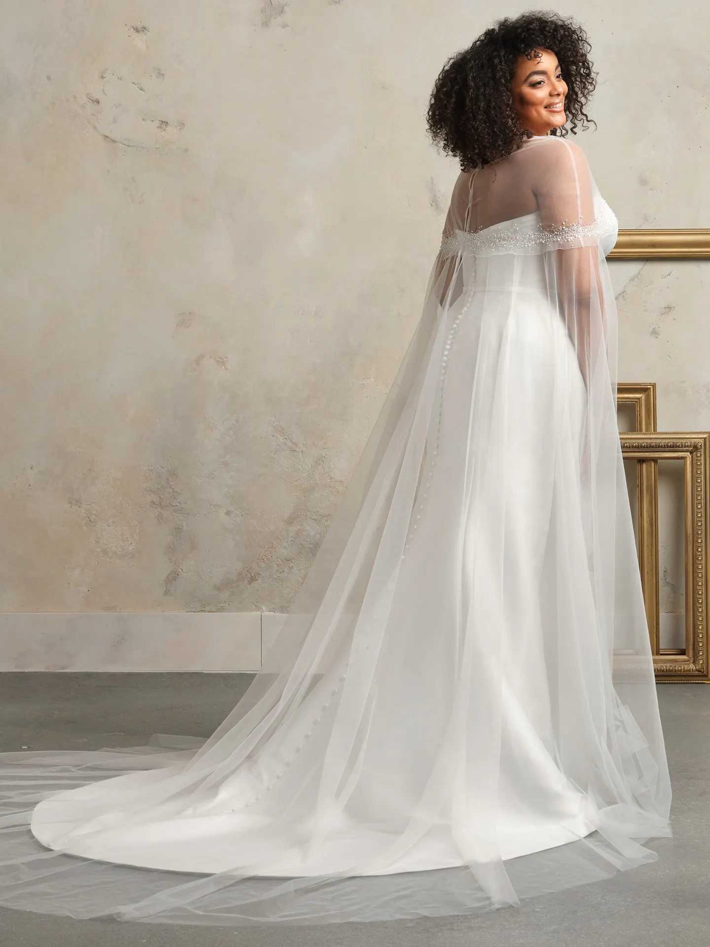 Maggie Sottero wedding dress back view with long beaded illusion cape