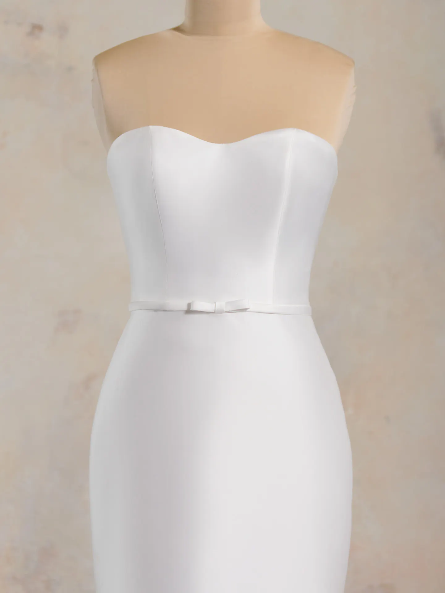 Maggie Sottero Maisie front view strapless wedding gown with bow detail