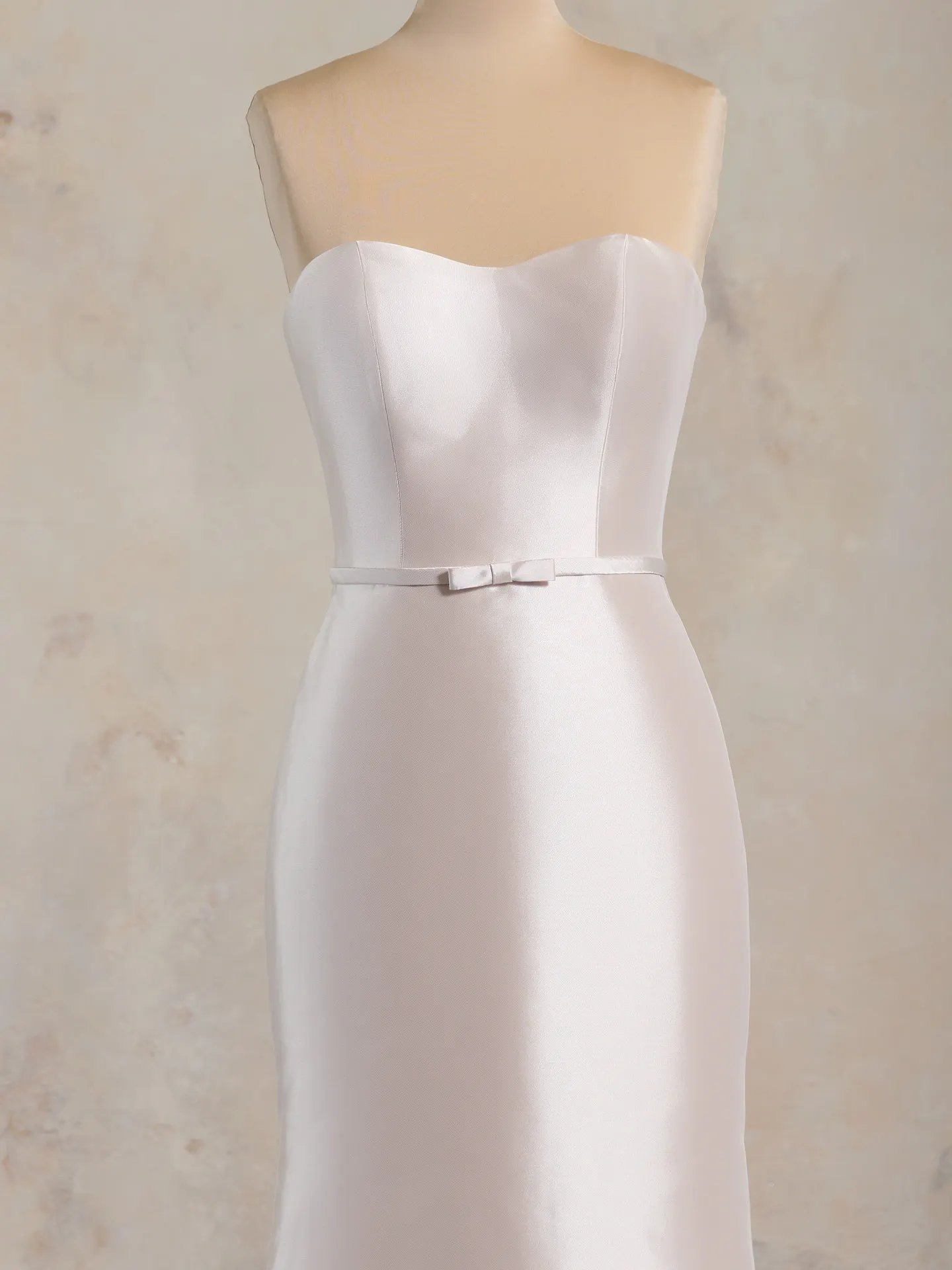 Maggie Sottero Maisie strapless gown, front view, with bow detail