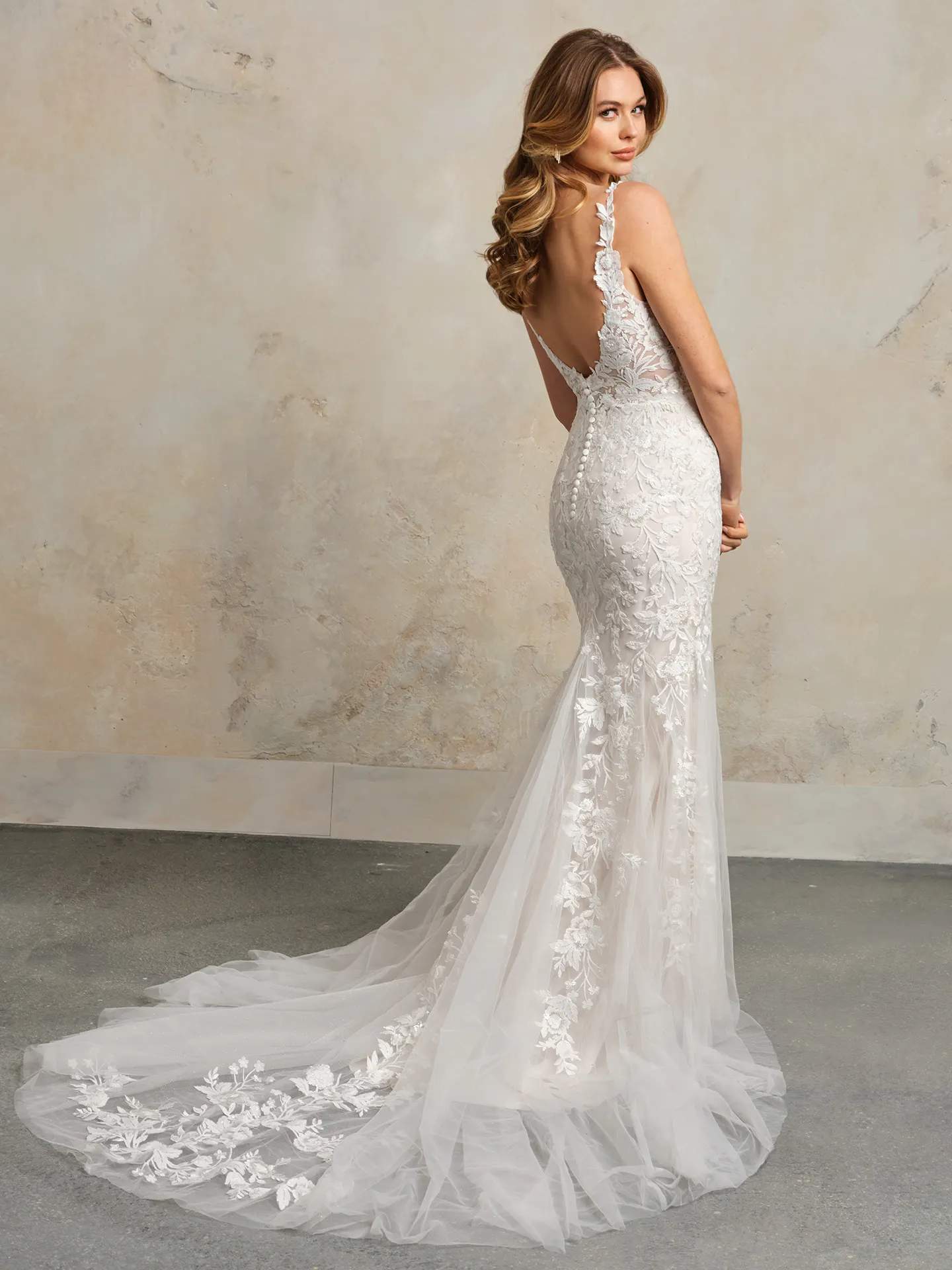Maggie Sottero Mandy fit-and-flare dress back view with floral lace details