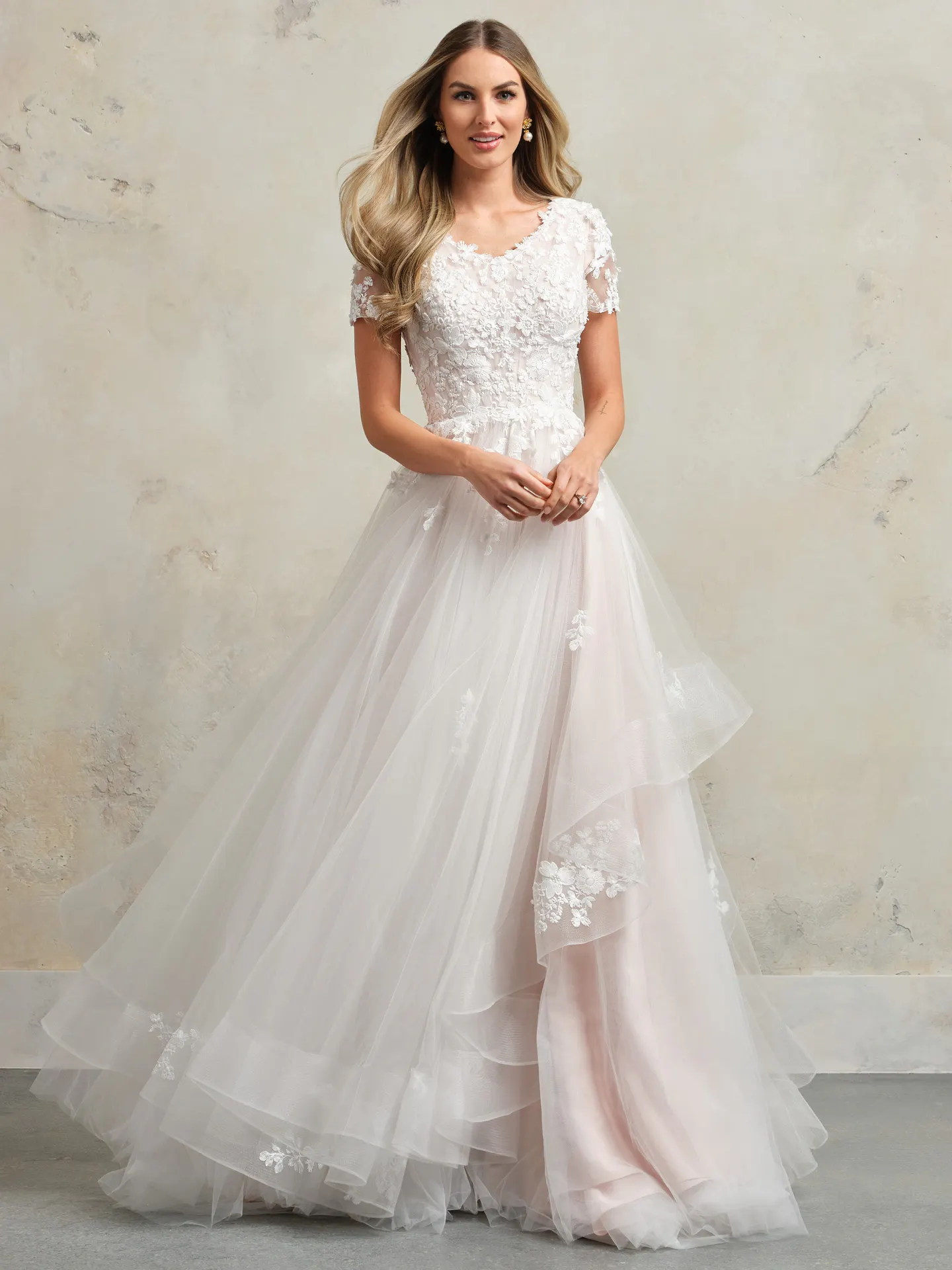 Winona Leigh front view floral lace ball gown with layered tulle skirt.