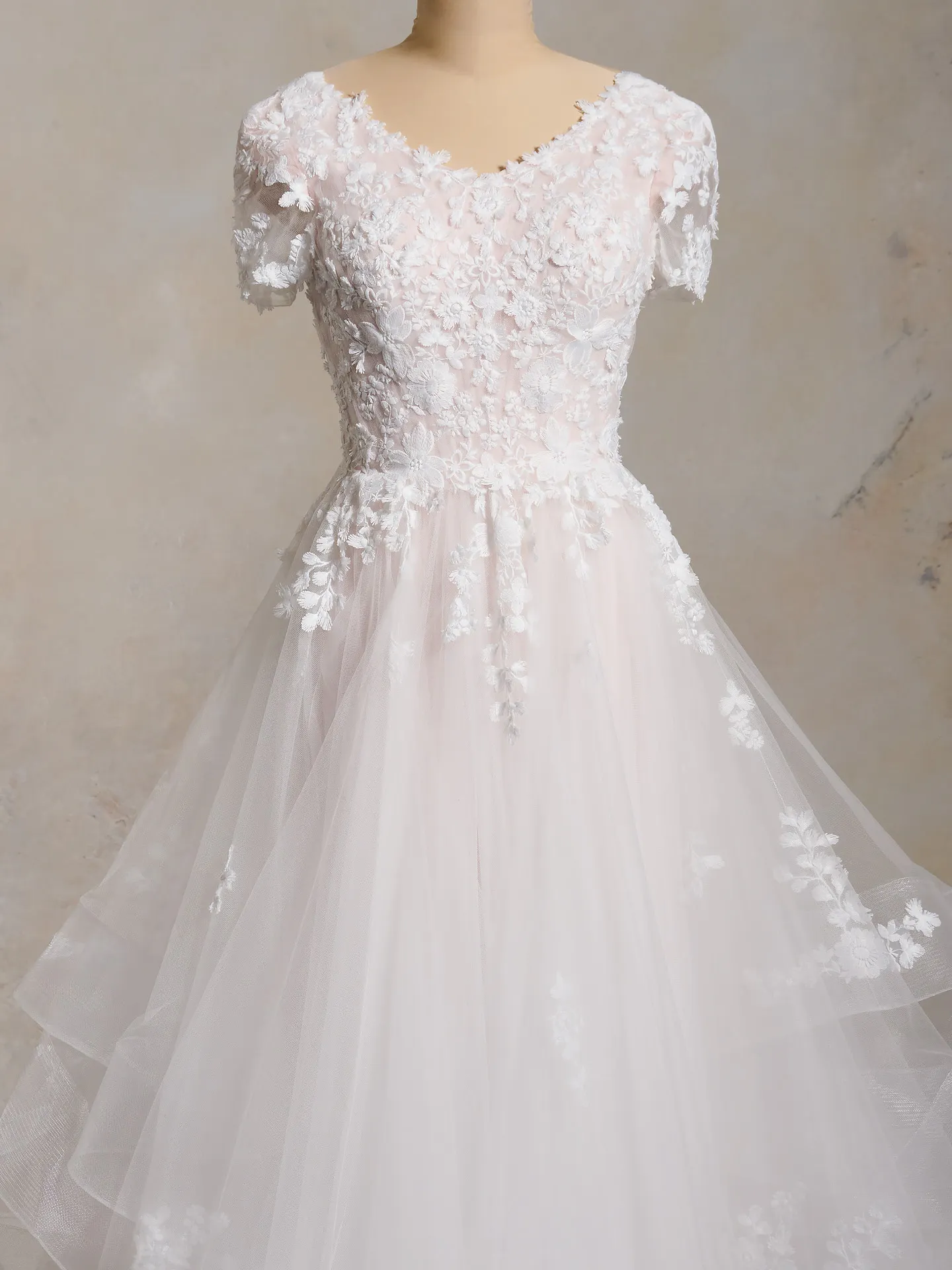 Winona Leigh ball gown, floral lace, soft tulle, front view.