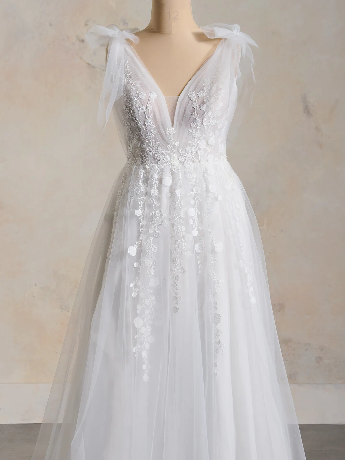 Maggie Sottero flowy floral lace V-neck gown front view