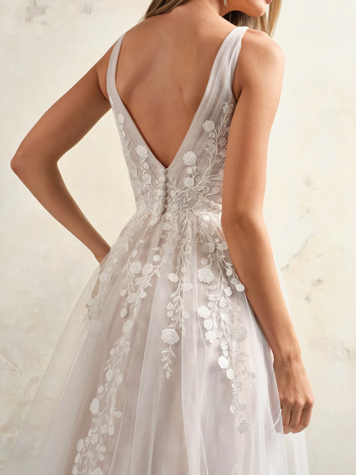 Maggie Sottero Zinnia back view, floral lace V-neck bridal gown