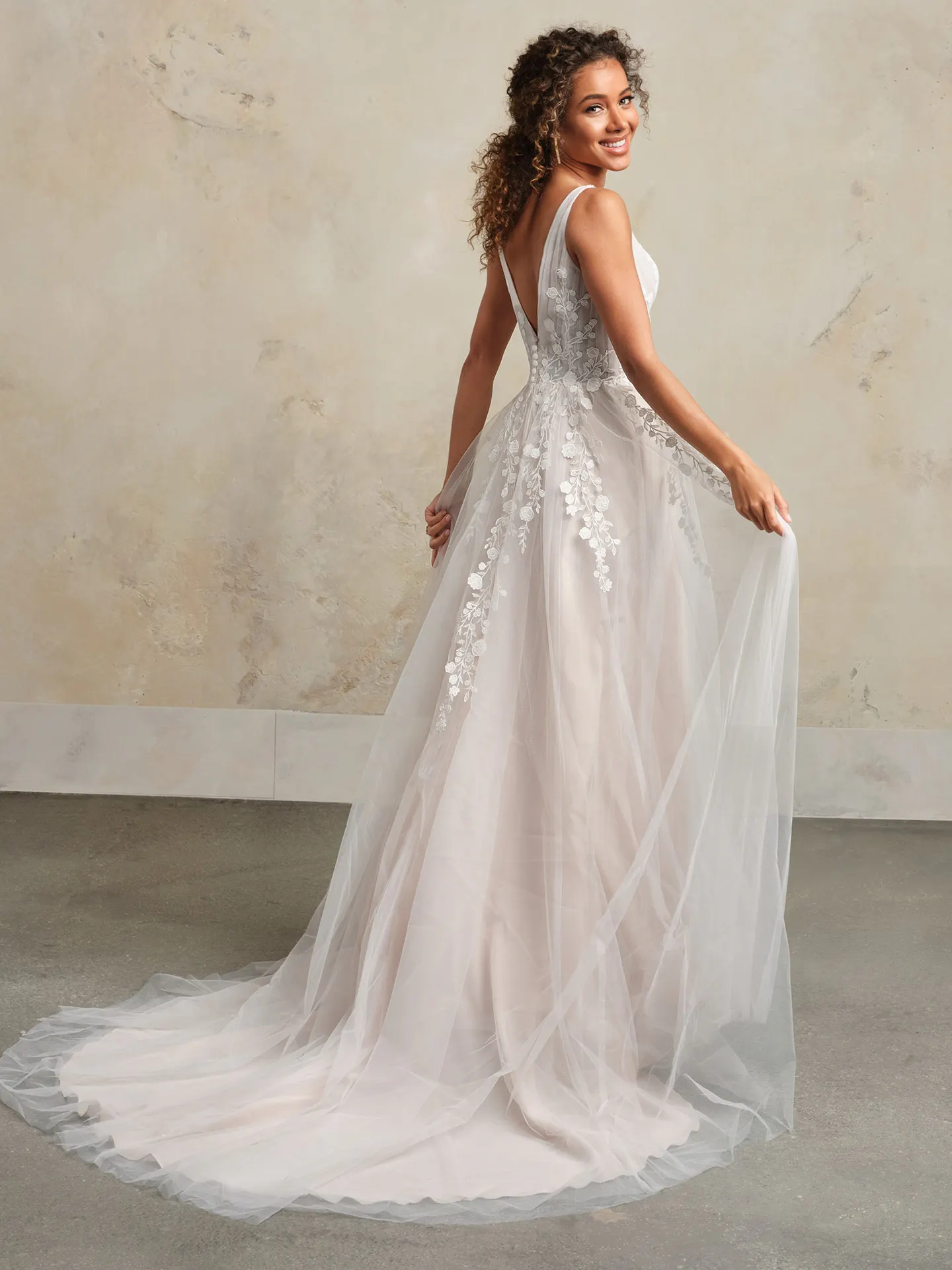 Maggie Sottero bridal gown back view with floral lace and V-neck