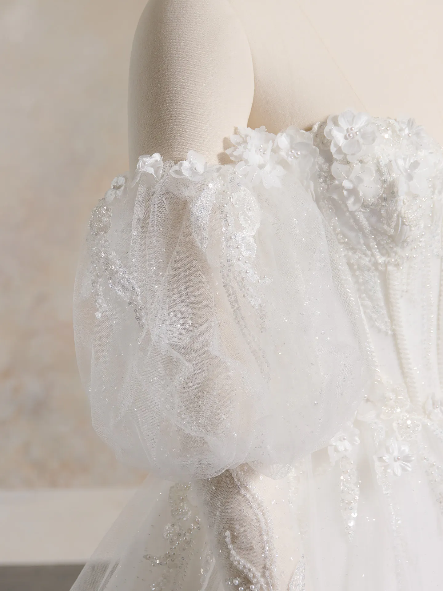 Fun Athlone dress side view, dotted glitter tulle, floral details, puff sleeve.