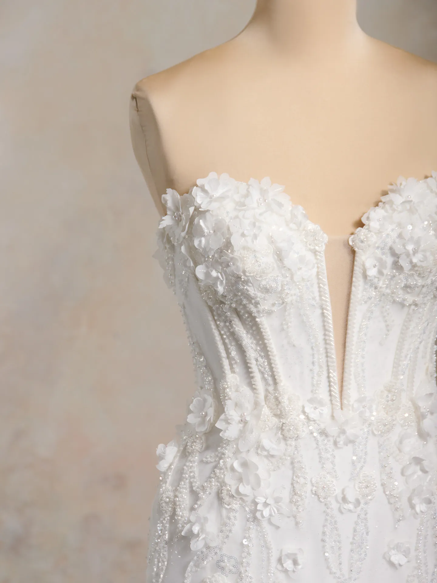 Maggie Sottero 3D floral bridal gown front view with pearl and flower embellishments.