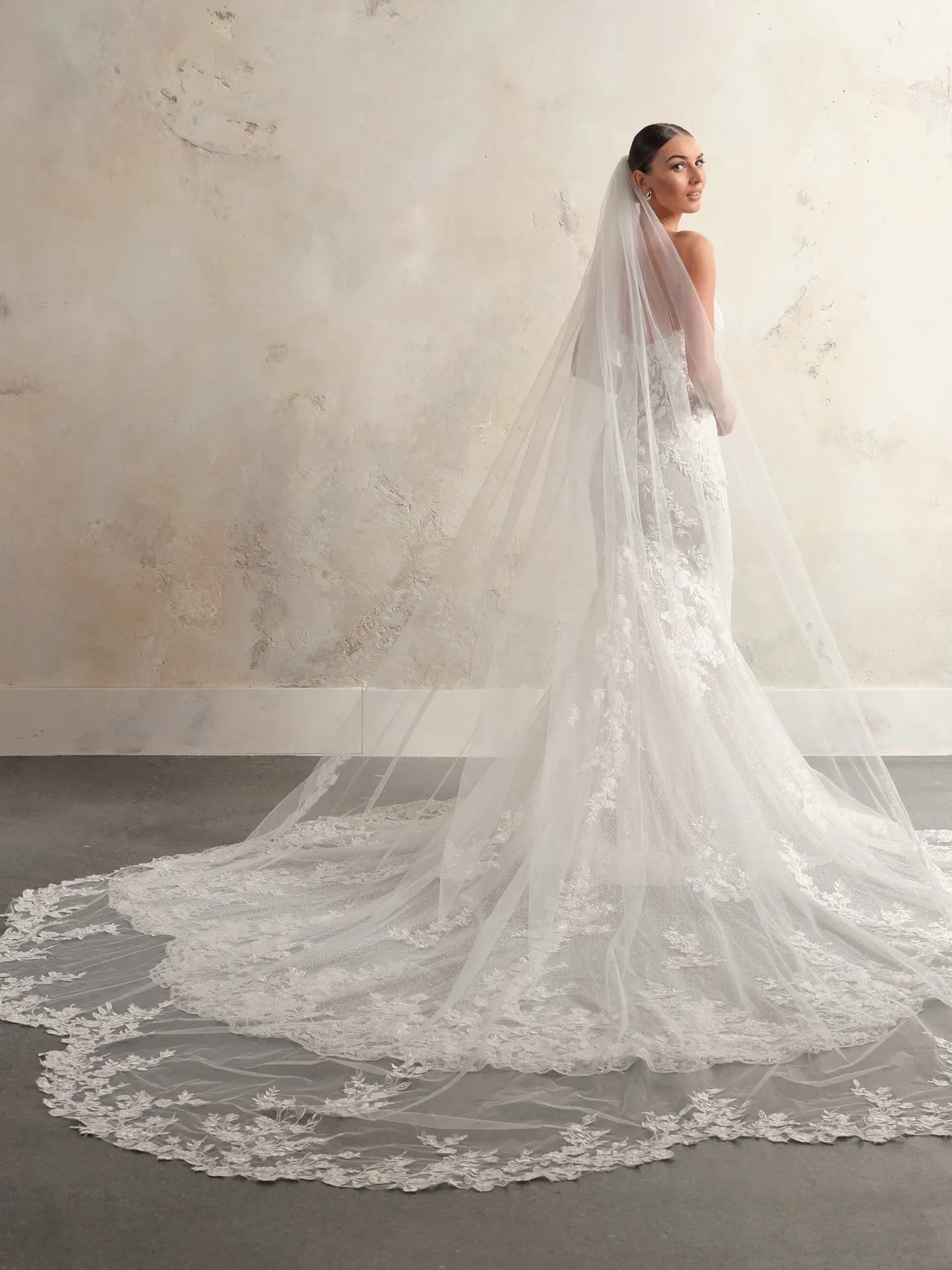 Sottero and Midgley back view of wedding dress with royal length scalloped beaded lace veil