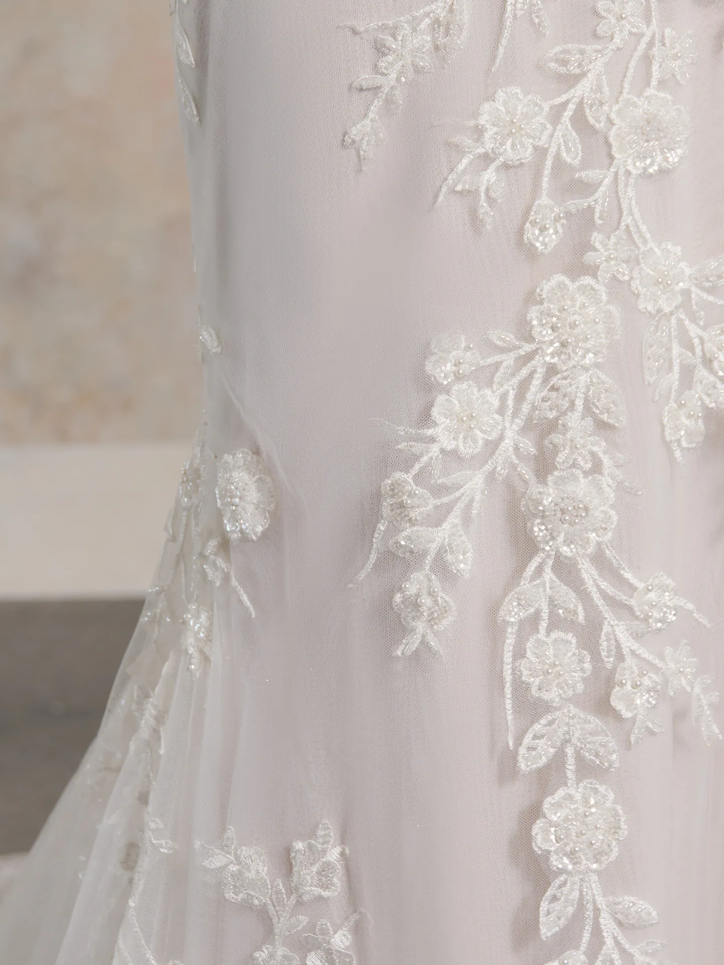 Chesney wedding dress close-up with floral lace detail.