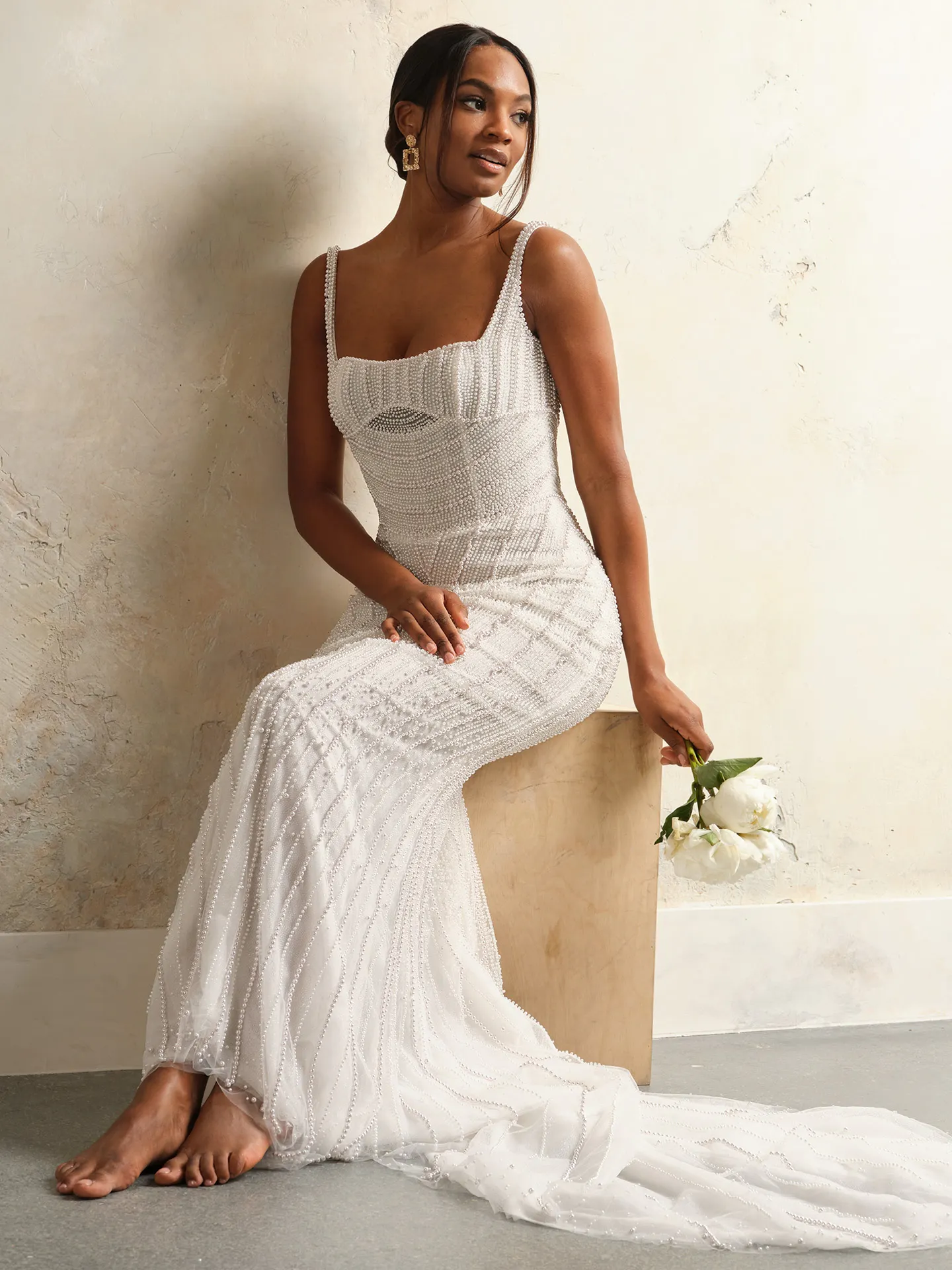 Maggie Sottero Danica front view with pearl detailing and basque waist.