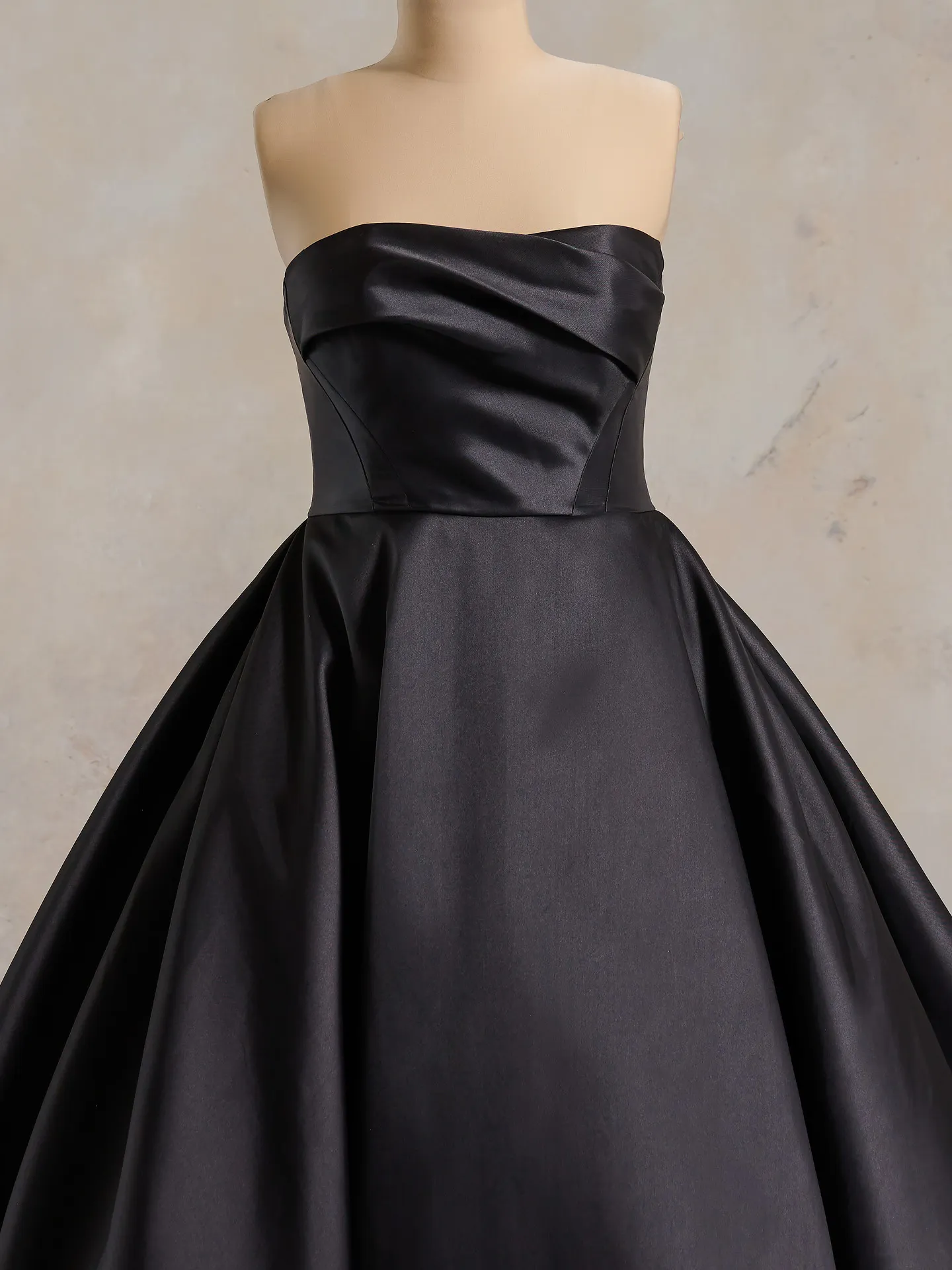Maggie Sottero black strapless asymmetrical bridal gown front view