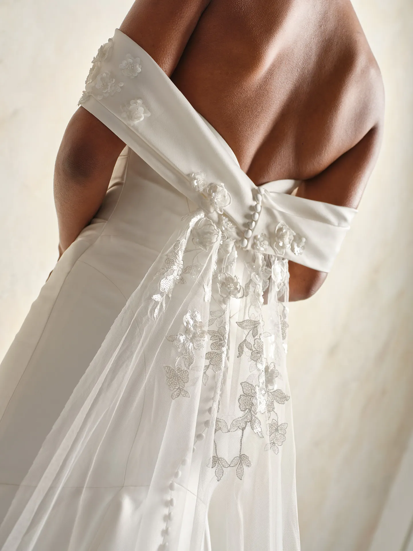 Sottero dress back view with lace train and satin shoulder wrap.