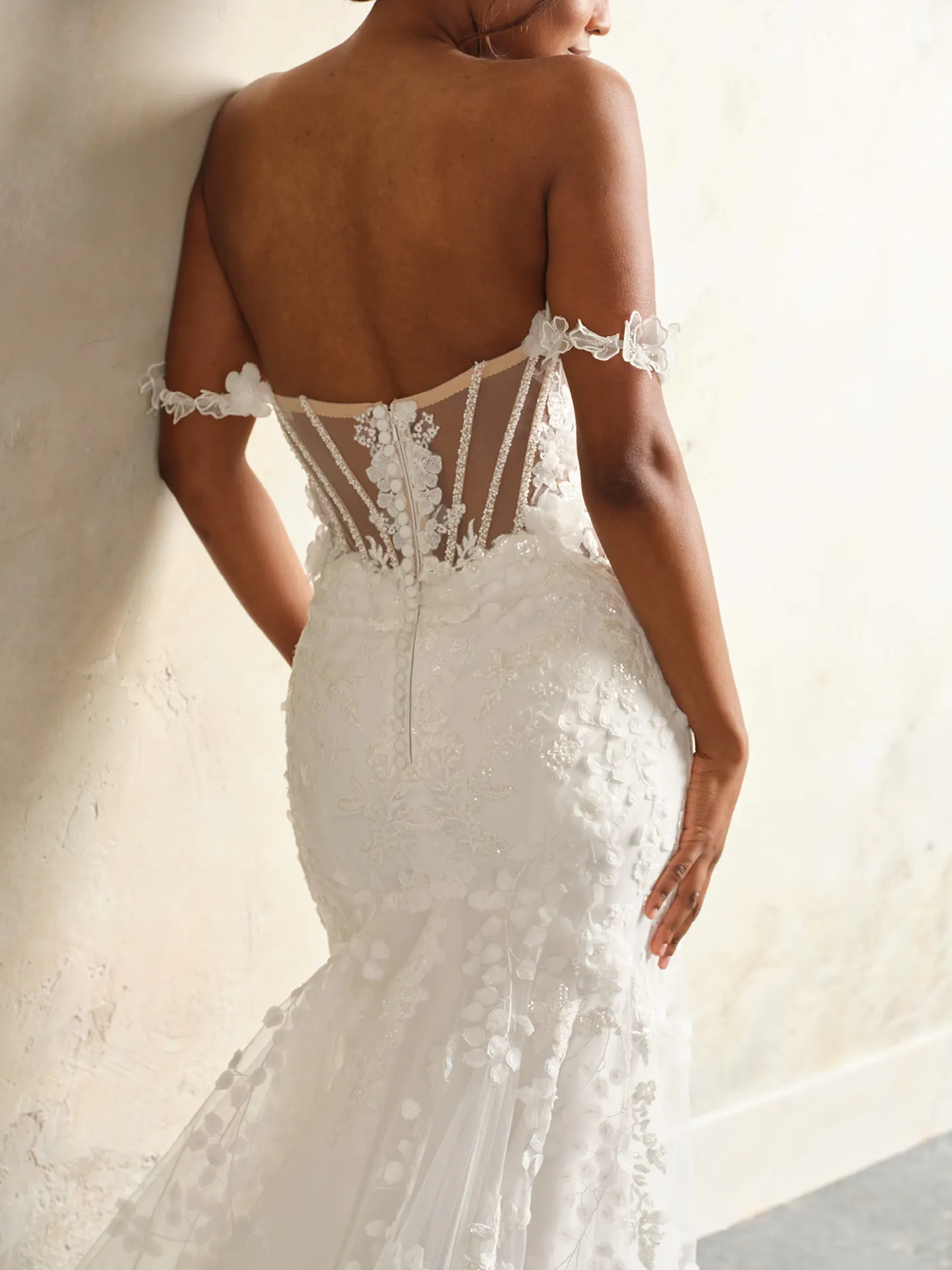 Kellen crisscross tulle wedding gown back view with floral detail.