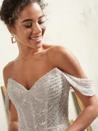 Ruched beaded tulle cap-sleeves with scattered pearl accents