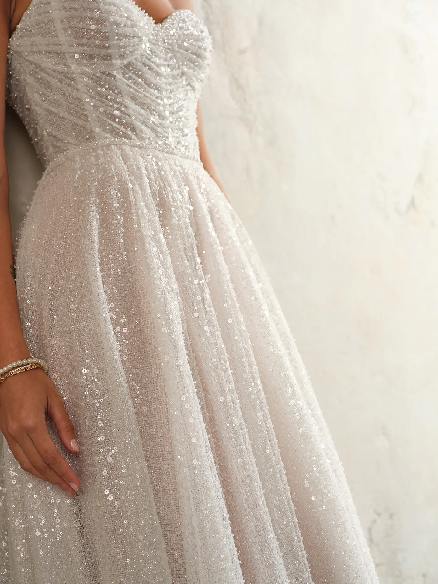 Sottero and Midgley Monica front view; sequined, off-the-shoulder bridal gown.