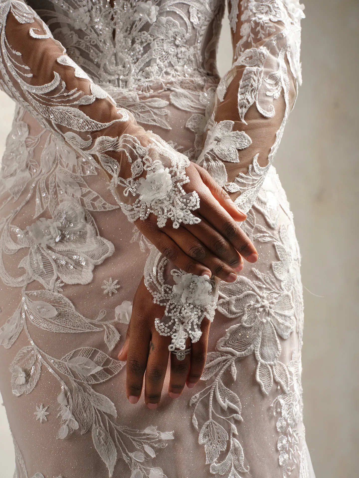 Nyjah wedding dress back view; scalloped lace, floral details, sparkling embellishments.