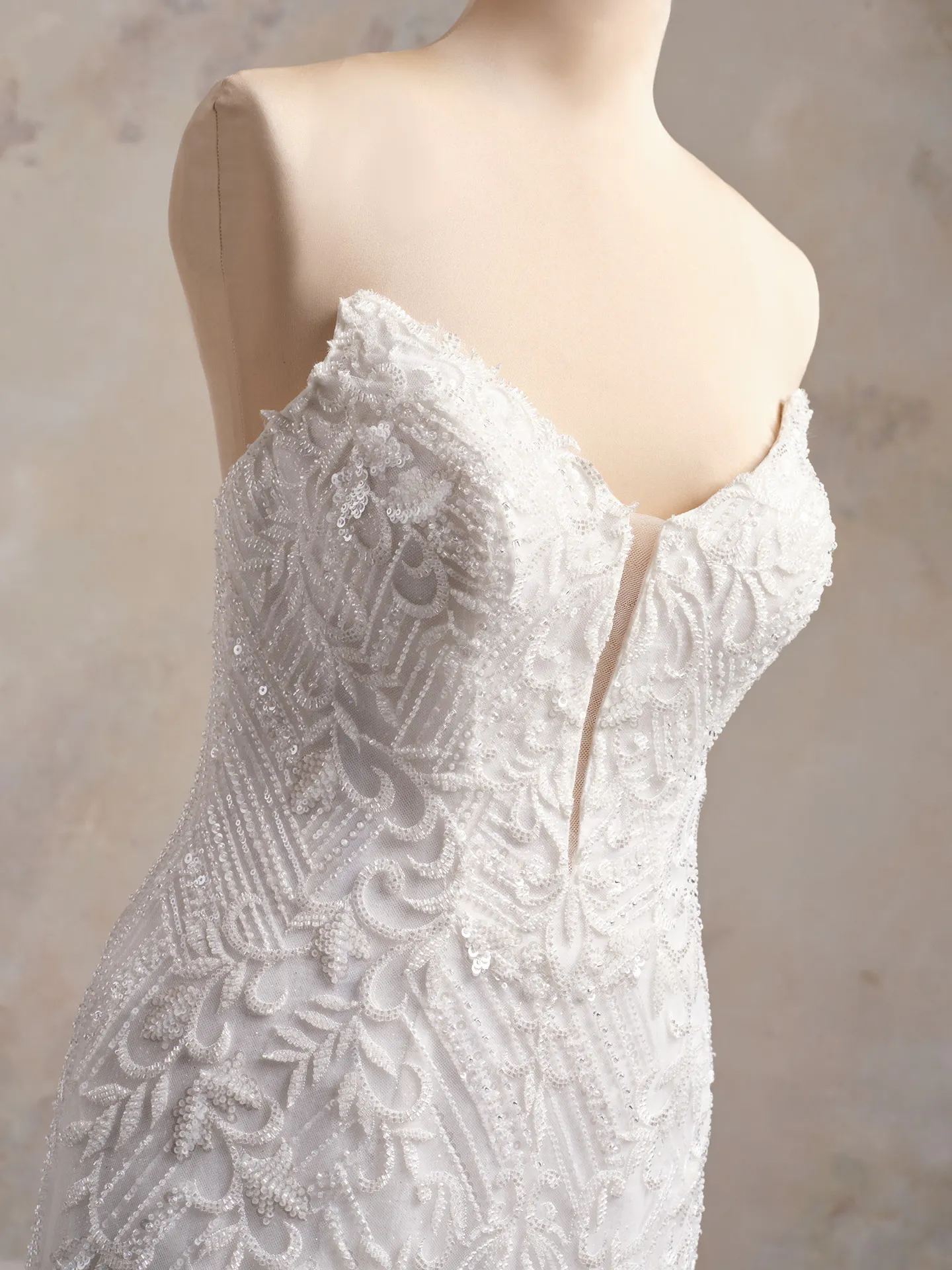 Beaded Sorrento strapless gown closeup view with intricate patterns.