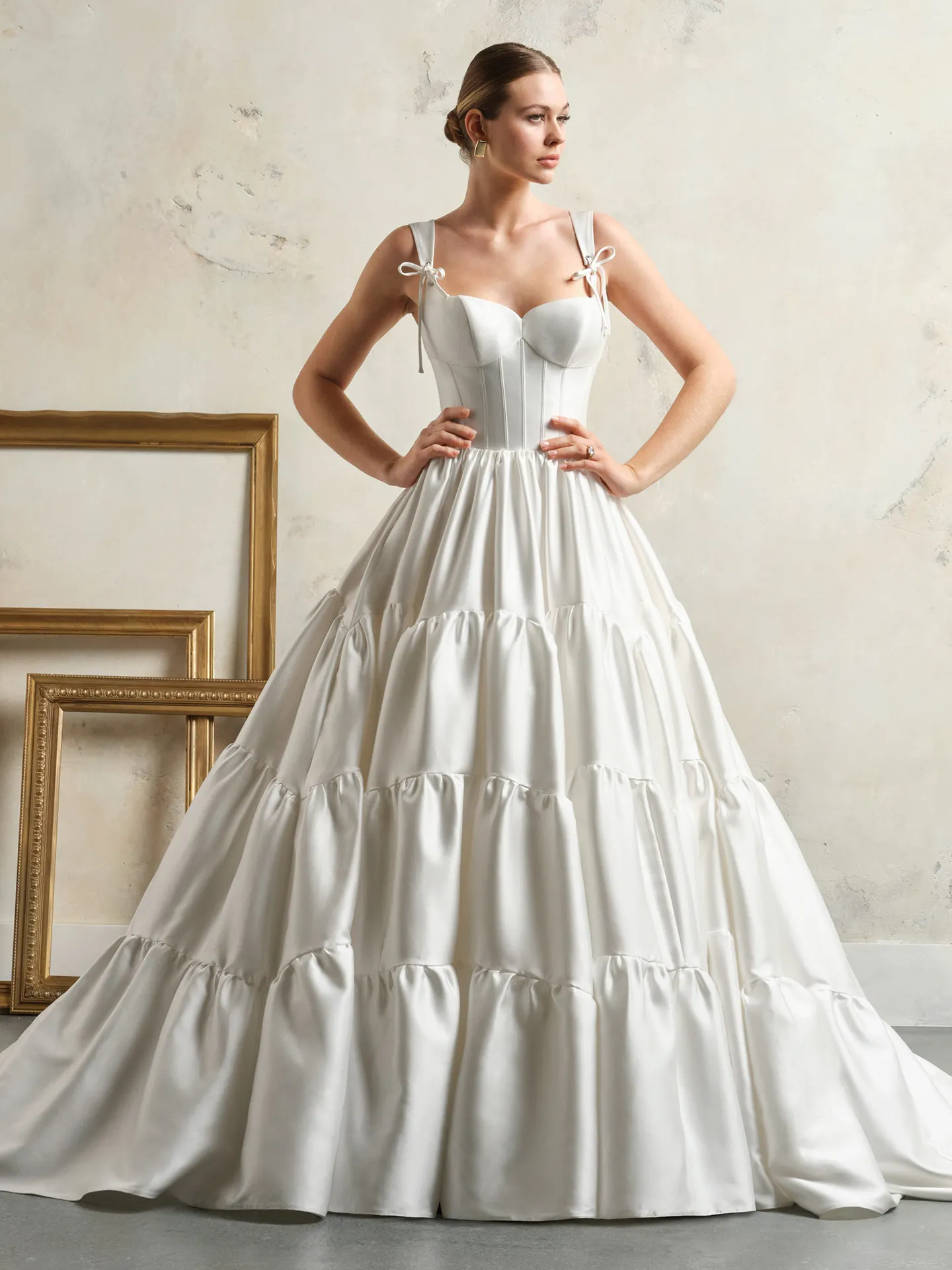 Maggie Sottero Talitha front view with bow corset and ruffled skirt