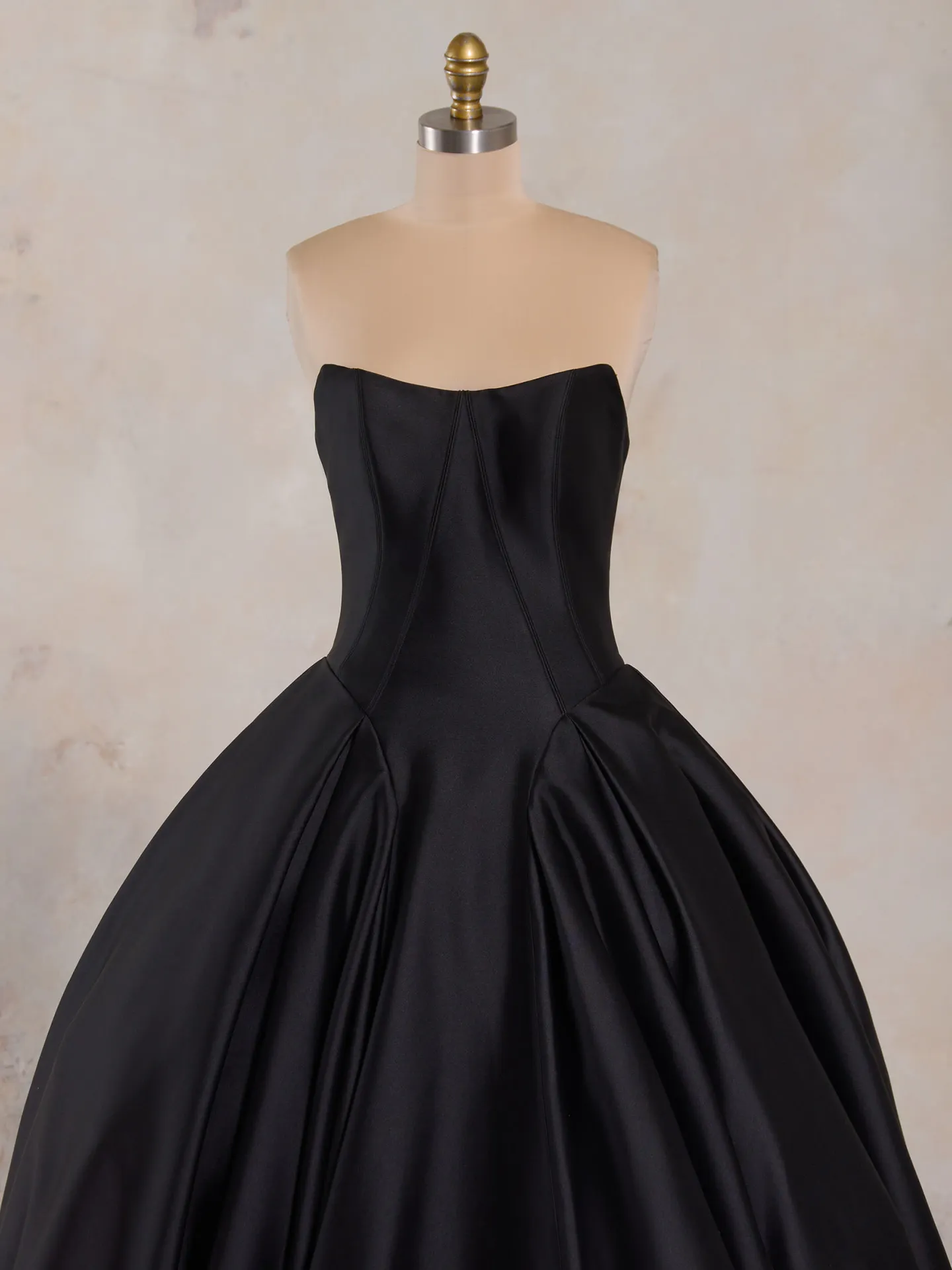 Fortune ballgown front view, strapless black satin dress on mannequin.