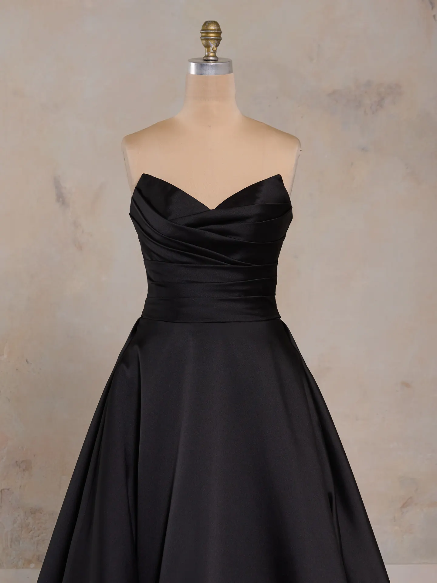 Maggie Sottero Ethelinda front view, black satin short dress on mannequin