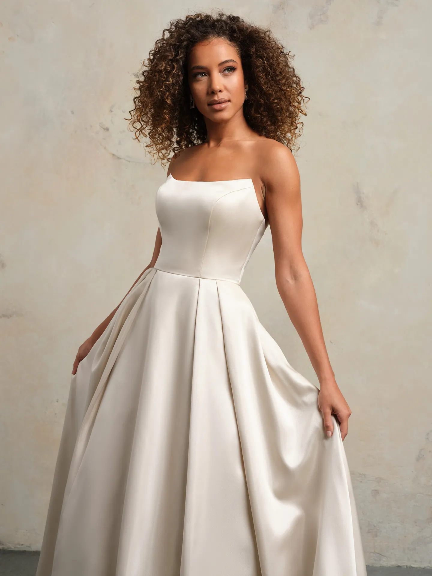 Selena Vida Satin gown front view with pockets.