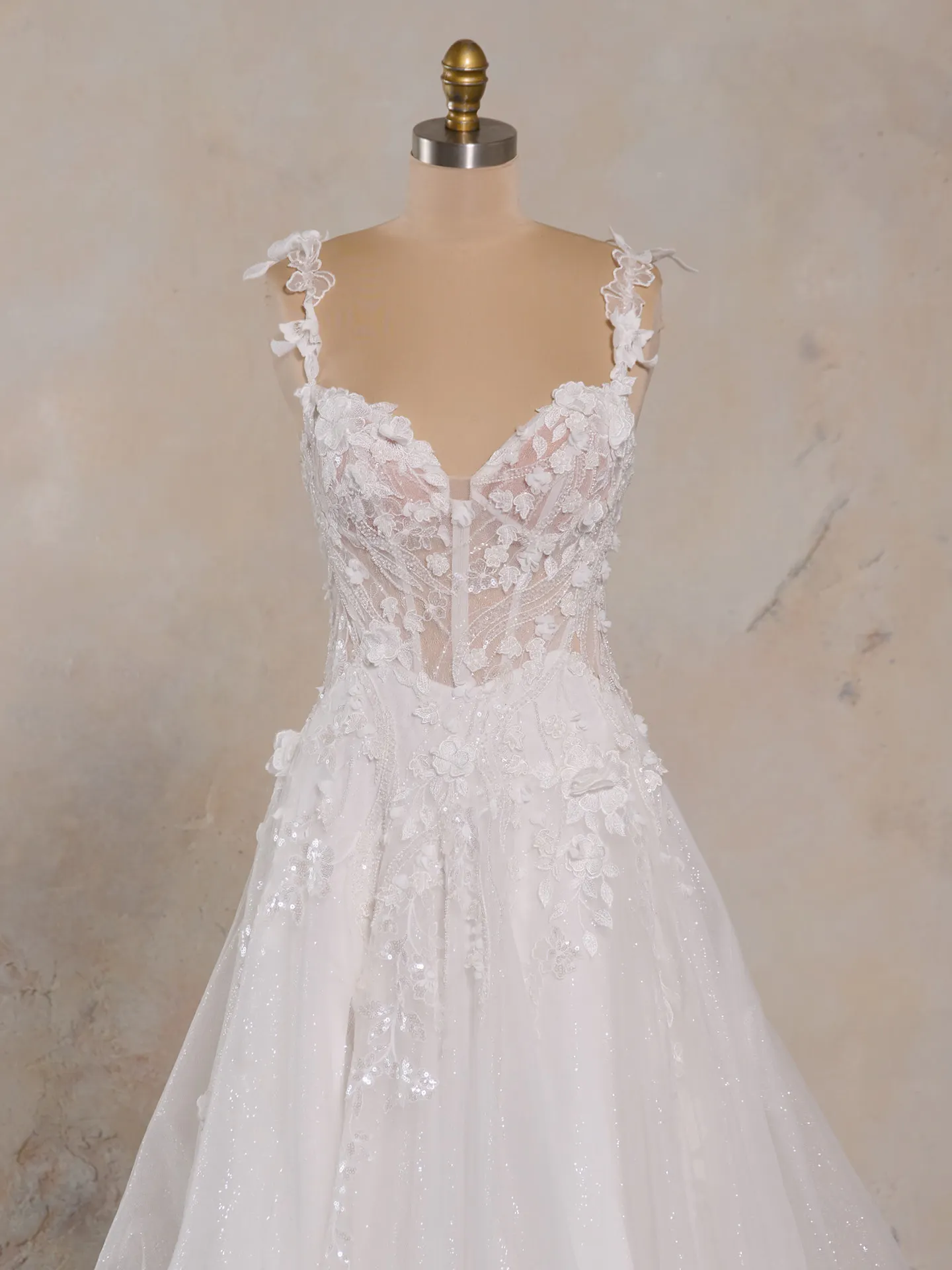 Maggie Sottero 3-D floral wedding dress front view on mannequin