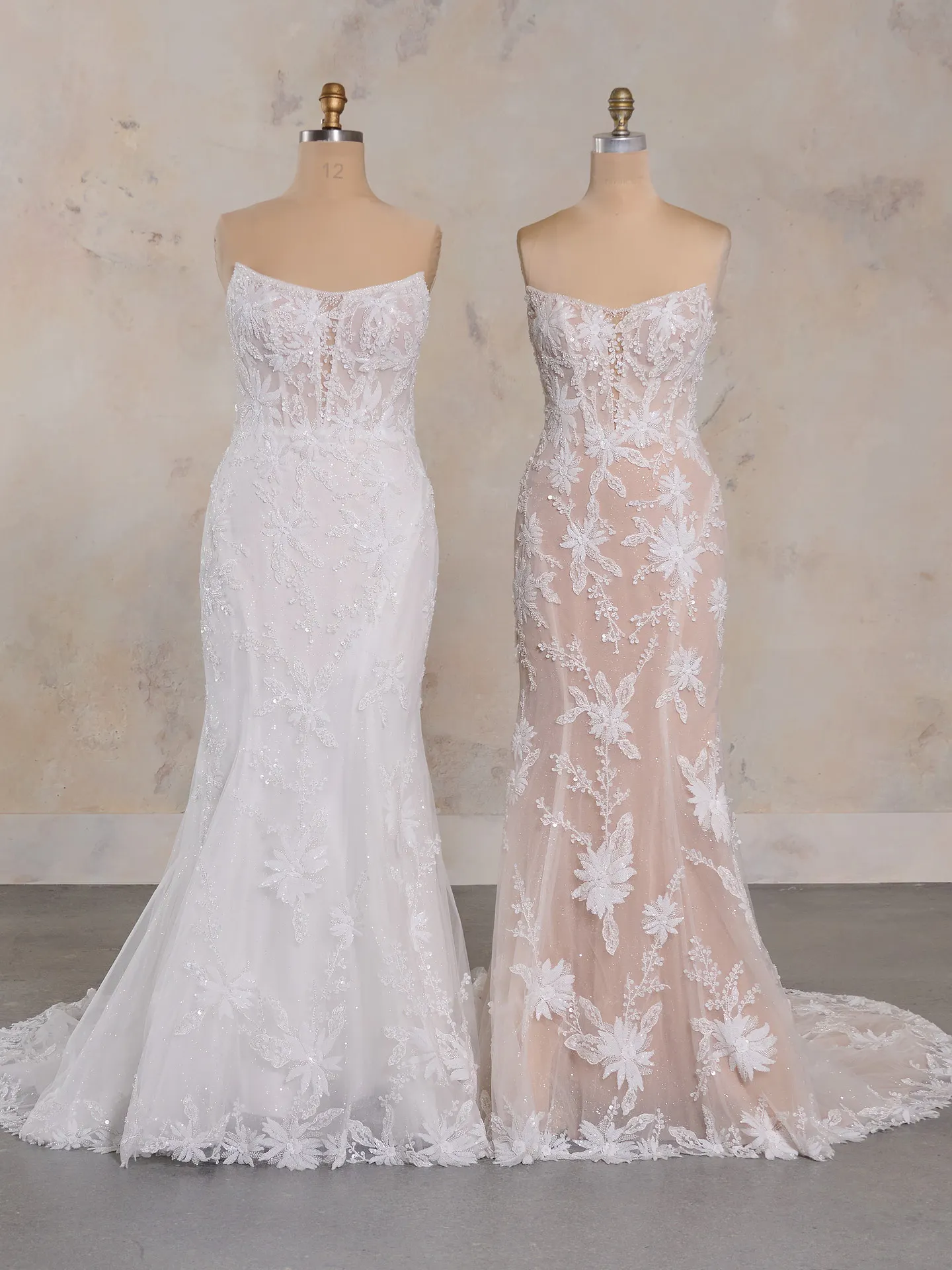 Sheer strapless Madrona lace corset wedding dresses on mannequins, side by side front view.