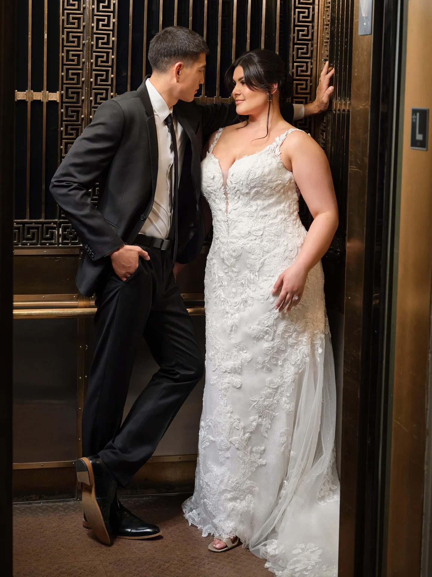 Sottero Zeta Lace Tulle Mermaid Wedding Gown front view in an elevator.