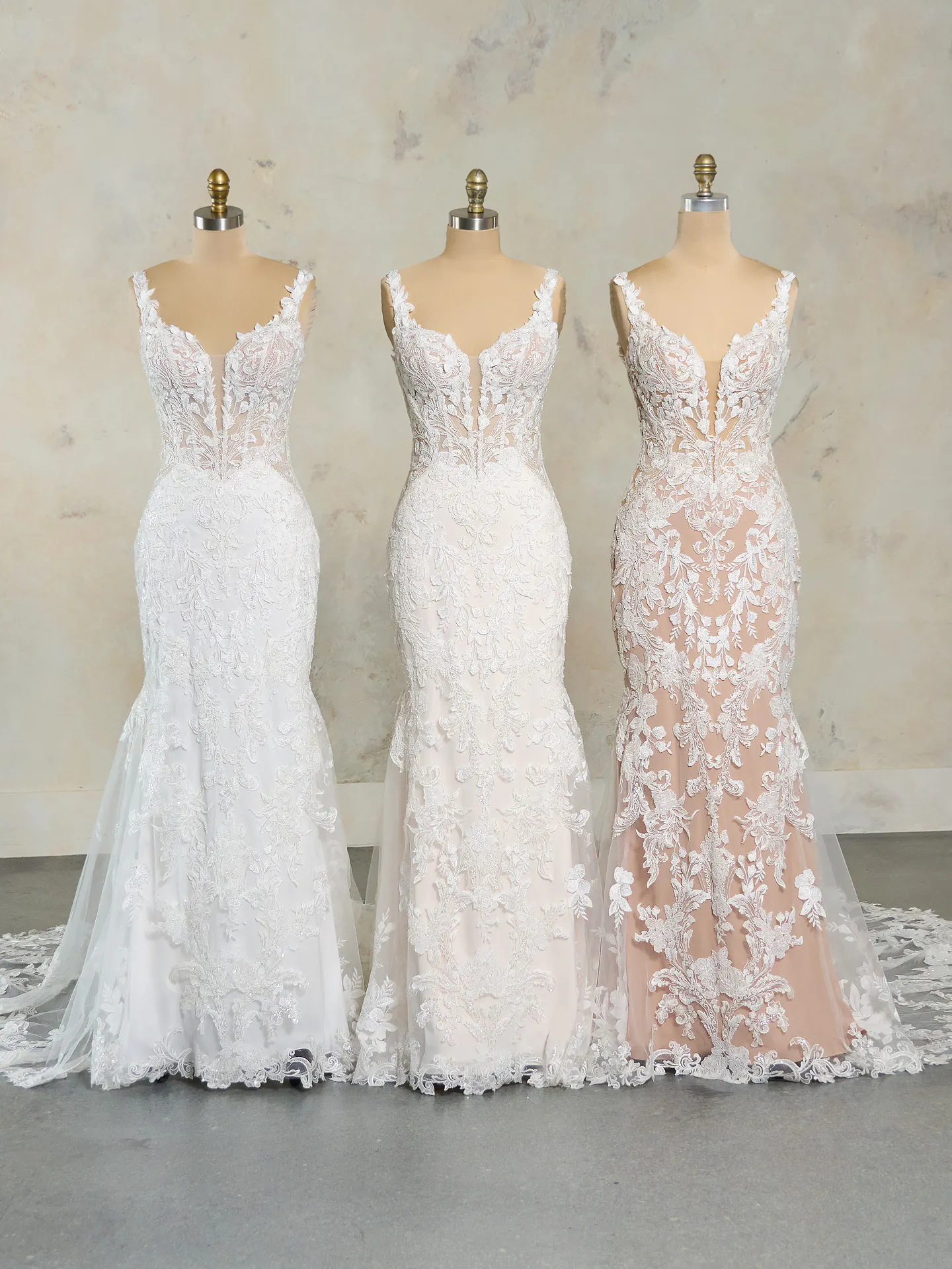 Maggie Sottero Zeta lace tulle mermaid gowns on mannequins front view
