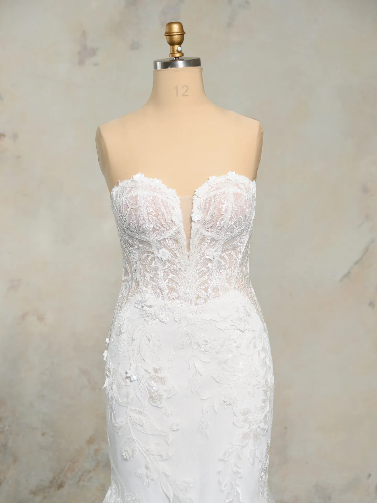 Rebecca Ingram Nyjah front view scalloped sparkling lace wedding dress on mannequin