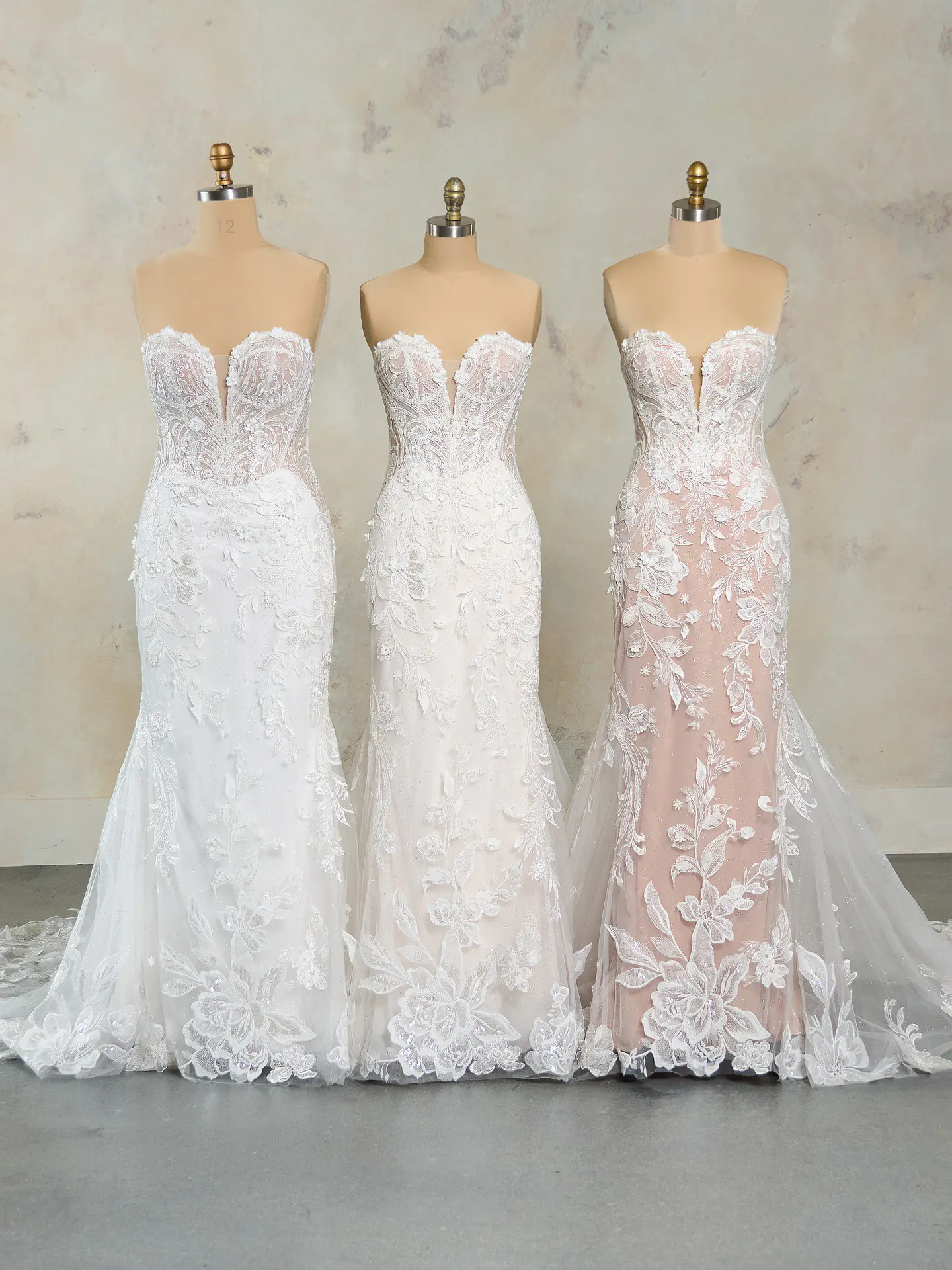 Nyjah lace wedding dress front view on mannequins.