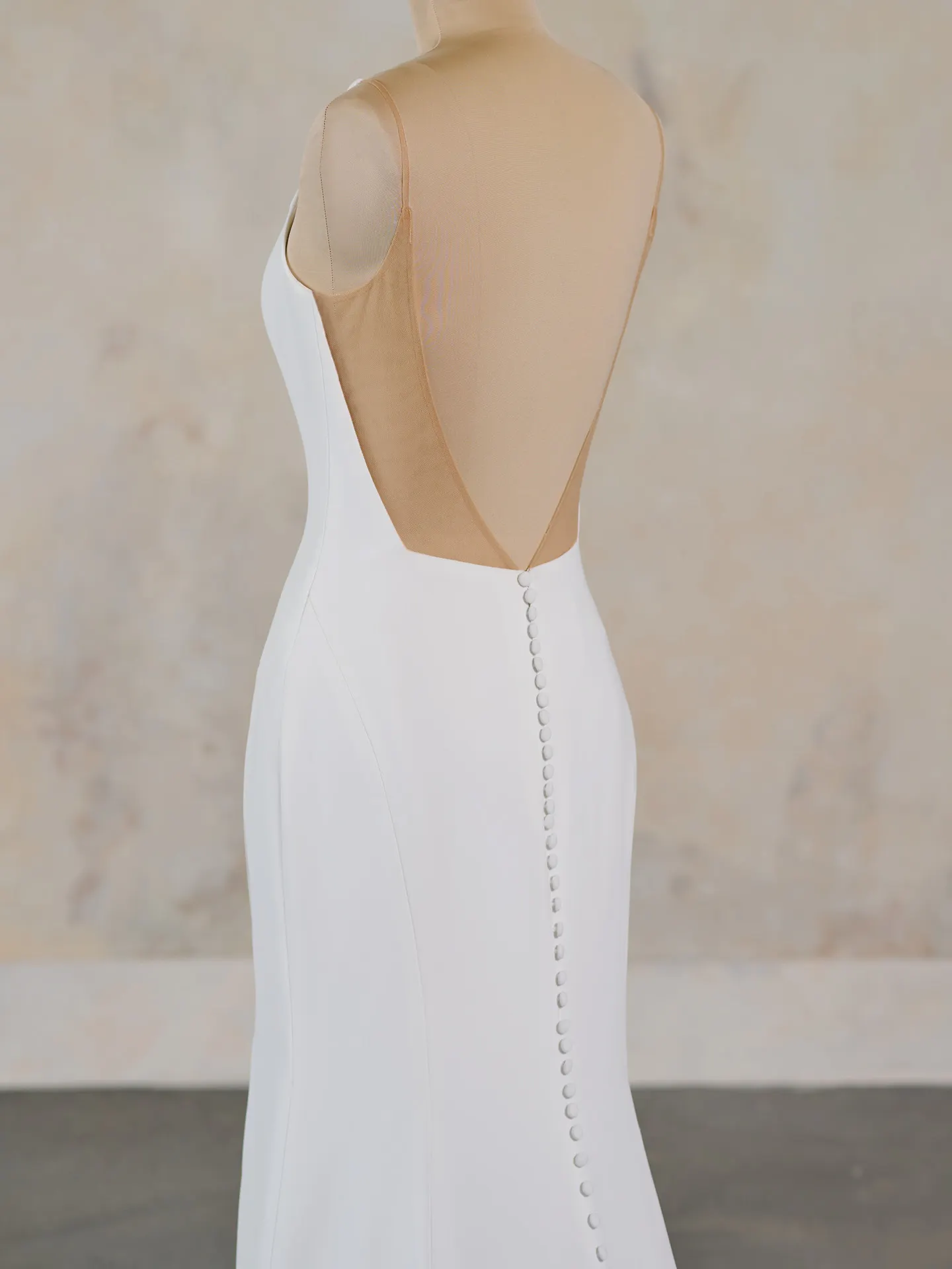 Rebecca Ingram Hope sheath gown side view with scoop neckline buttons down back