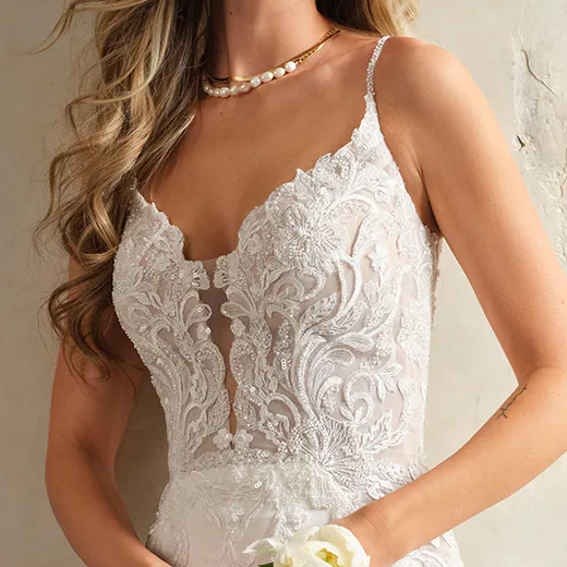 Maggie Sottero Anastasia lace bodice close-up with floral details.