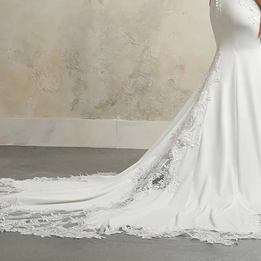 Maggie Sottero Anastasia side view beaded crepe bridal gown with lace train